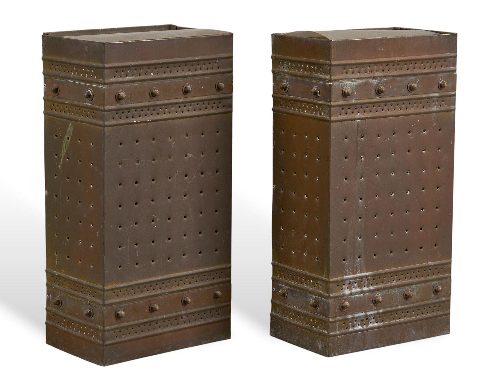 Isaac Maxwell (San Antonio, Texas) Pair of Pierced Wall Sconces: Isaac Maxwell (San Antonio, Texas), pair of matching sconce light fixtures, with copper body and punched accentsheight 16 in. x width 8 in. x depth 5 in. / eachProvenance: Property from a home in San