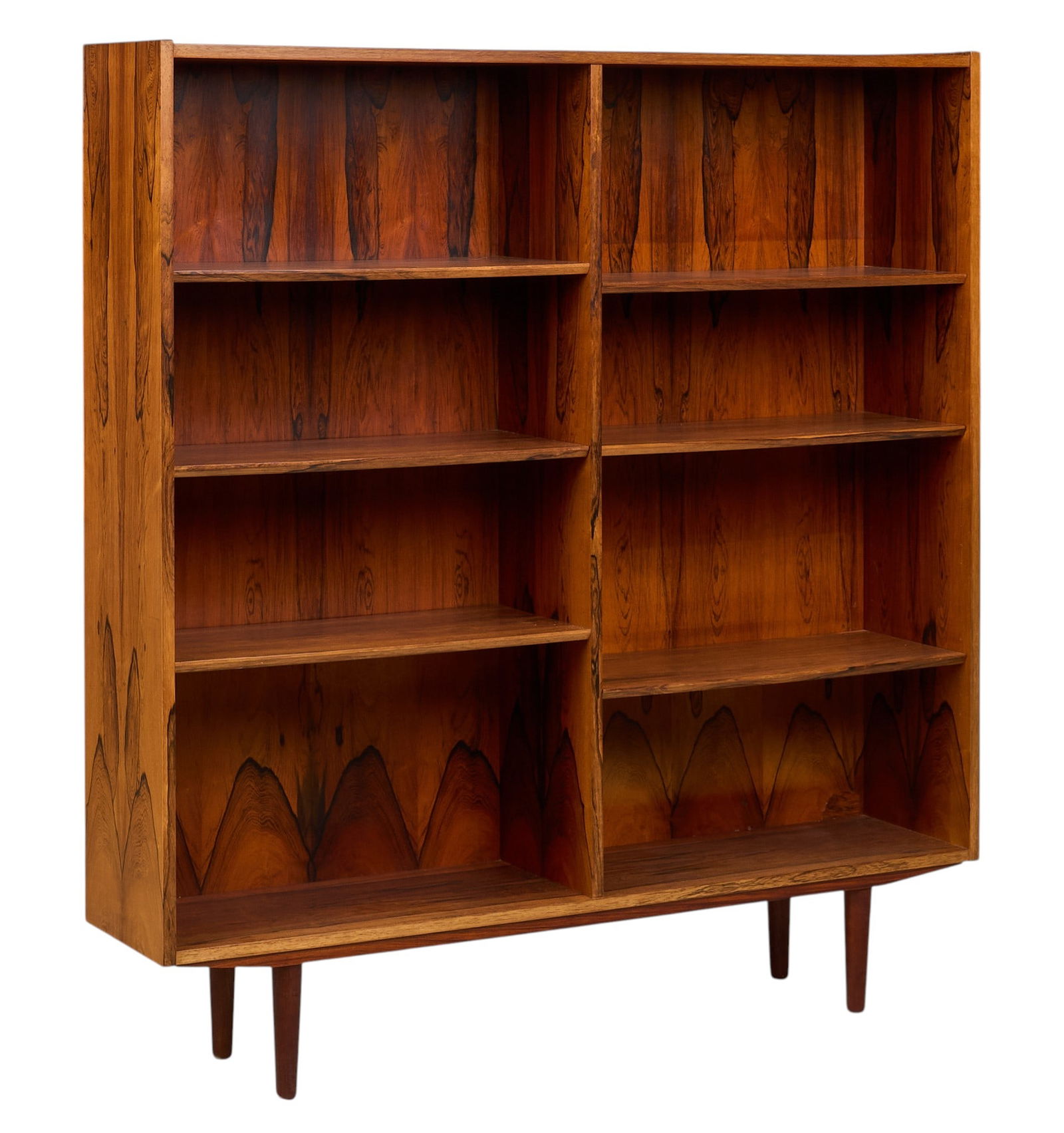 Danish Mid-Century Bookcase: Danish mid-century bookcase with six adjustable shelves, supported on pin legs height 59 in. x width 54.5 in. x depth 12 in. 