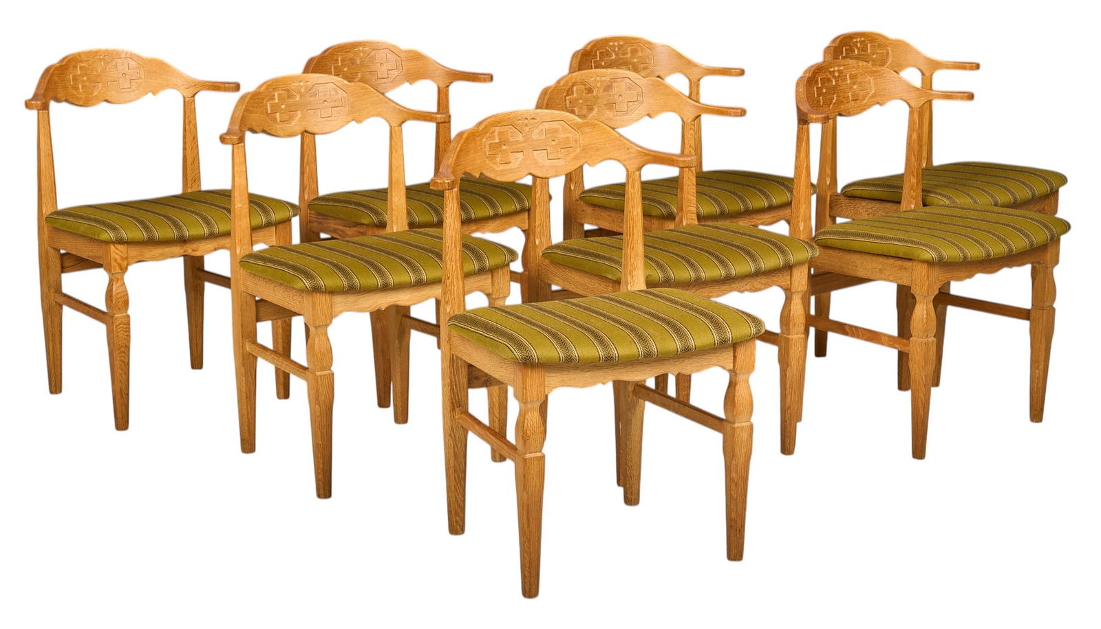 Set of (8) Henning Kjaernulf Mid-Century Oak Dining Chairs: Set of eight Henning Kjaernulf (Denmark) mid-century oak dining chairs with cushioned seats clad in green striped upholstery fabric, supported on carved and stretchered block legsheight 31 in. x