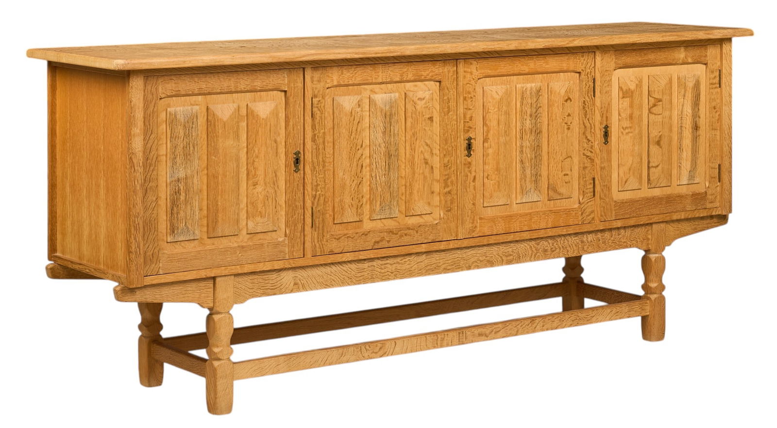 Henning Kjaernulf, Mid-Century Credenza: Henning Kjaernulf (Denmark) oak mid-century credenza with four cabinet doors, and interior shelving, supported on sculpted block legsheight 35.5 in. x width 83 in. x depth 19.5 in. 