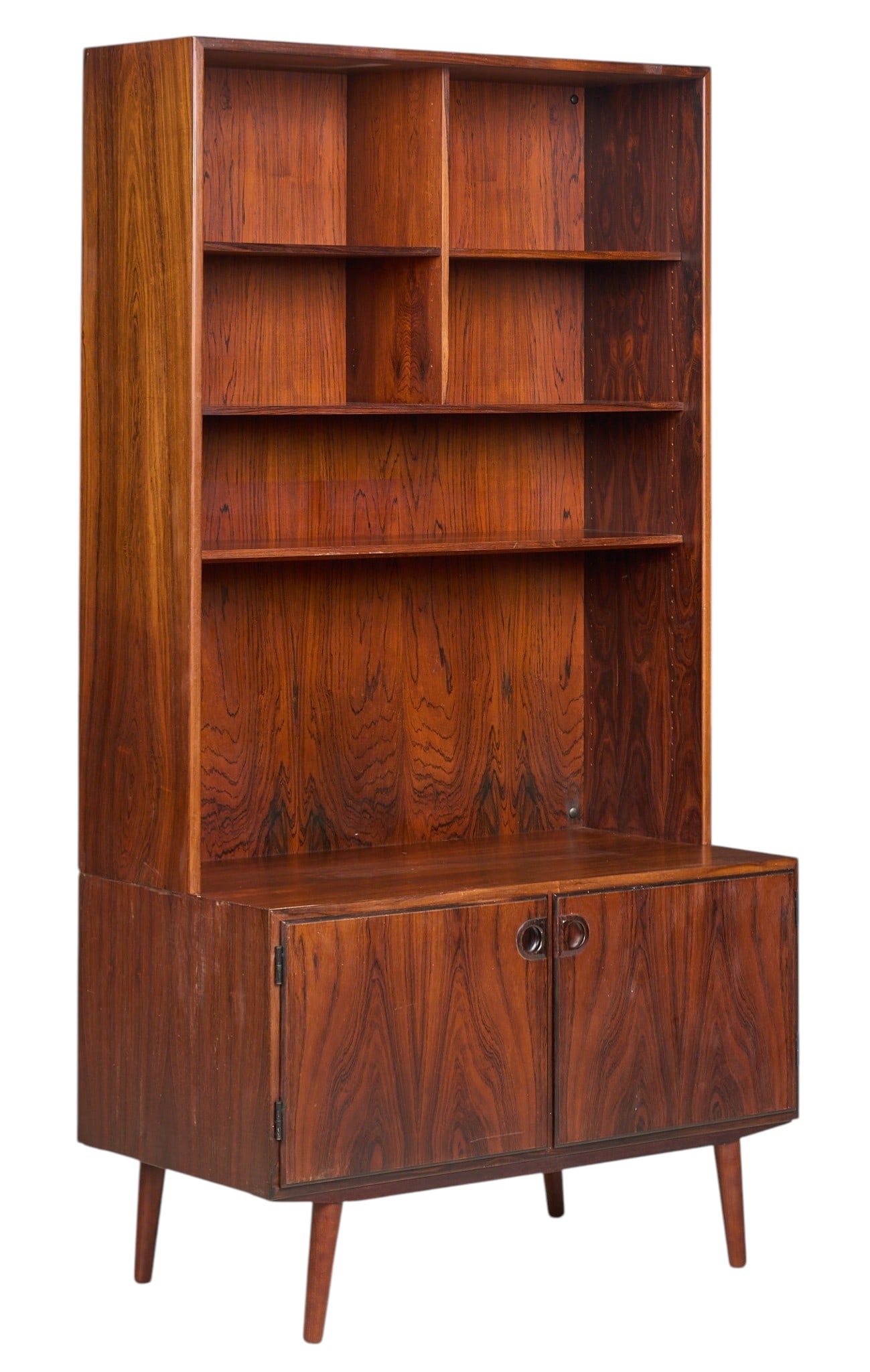 Danish Mid-Century Bookcase: Danish mid-century bookcase with three adjustable shelves, and bottom cabinet, supported on pin legs, marked with Danish Furniture Maker's stickers on back height 73 in. x width 39.5 in. x depth 2