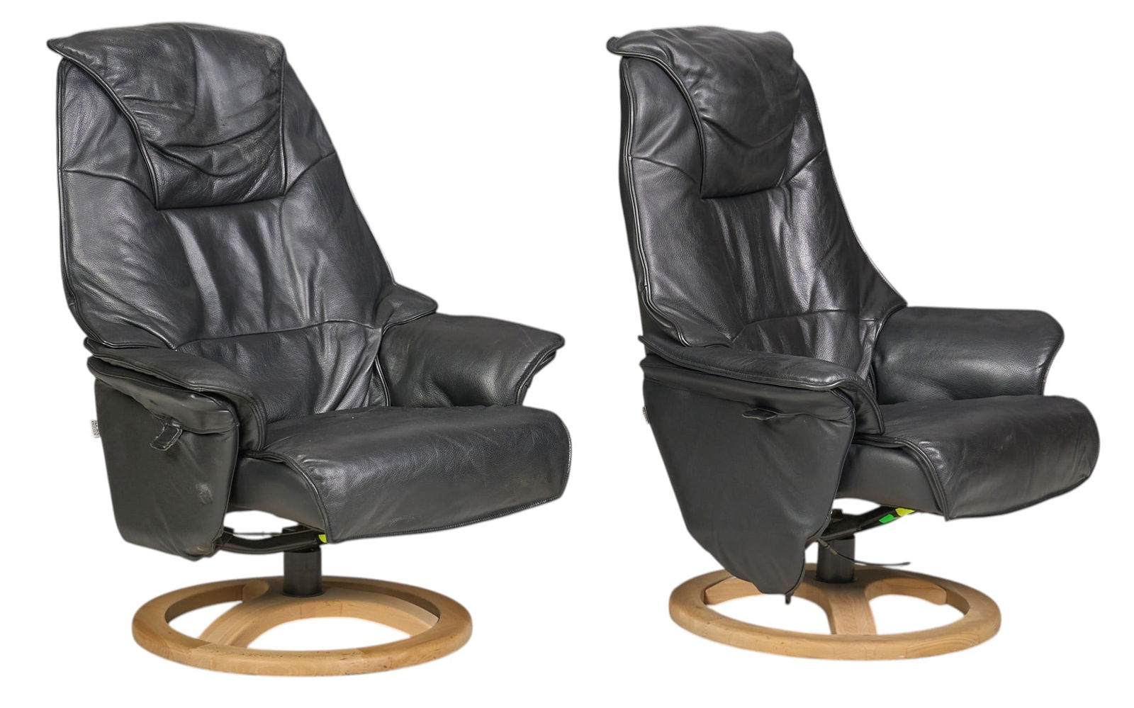 Pair of Black Leather Lounge Chairs: Pair of lounge chairs with black leather upholstery, padded armrests, and swivel basesheight 42 in. x width 33 in. x depth 30 in. / each