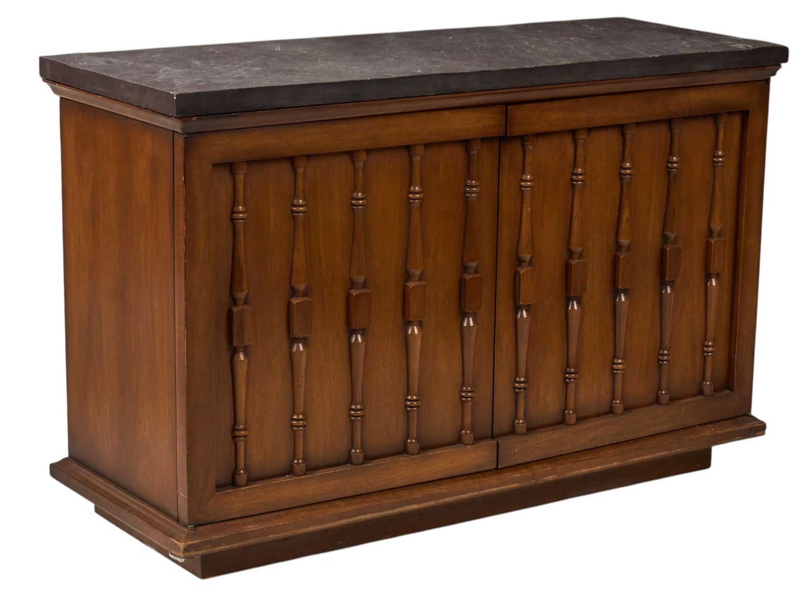 Slate Top Mid-Century Cabinet: Mid-century cabinet with removable slate top, pair of cabinet doors, and single interior shelf, supported on plinthheight 28.5 in. x width 44 in. x depth 17 in. Provenance: Property from a home