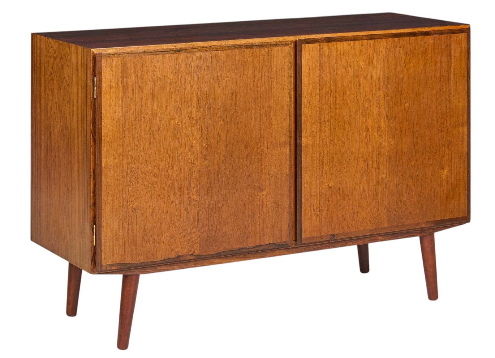 Danish Mid-Century Credenza: Danish mid-century credenza with pair of doors opening to divided a interior with flatware trays and adjustable shelves, supported on pin legs height 31.5 in. x width 47.5 in. x depth 17 in.