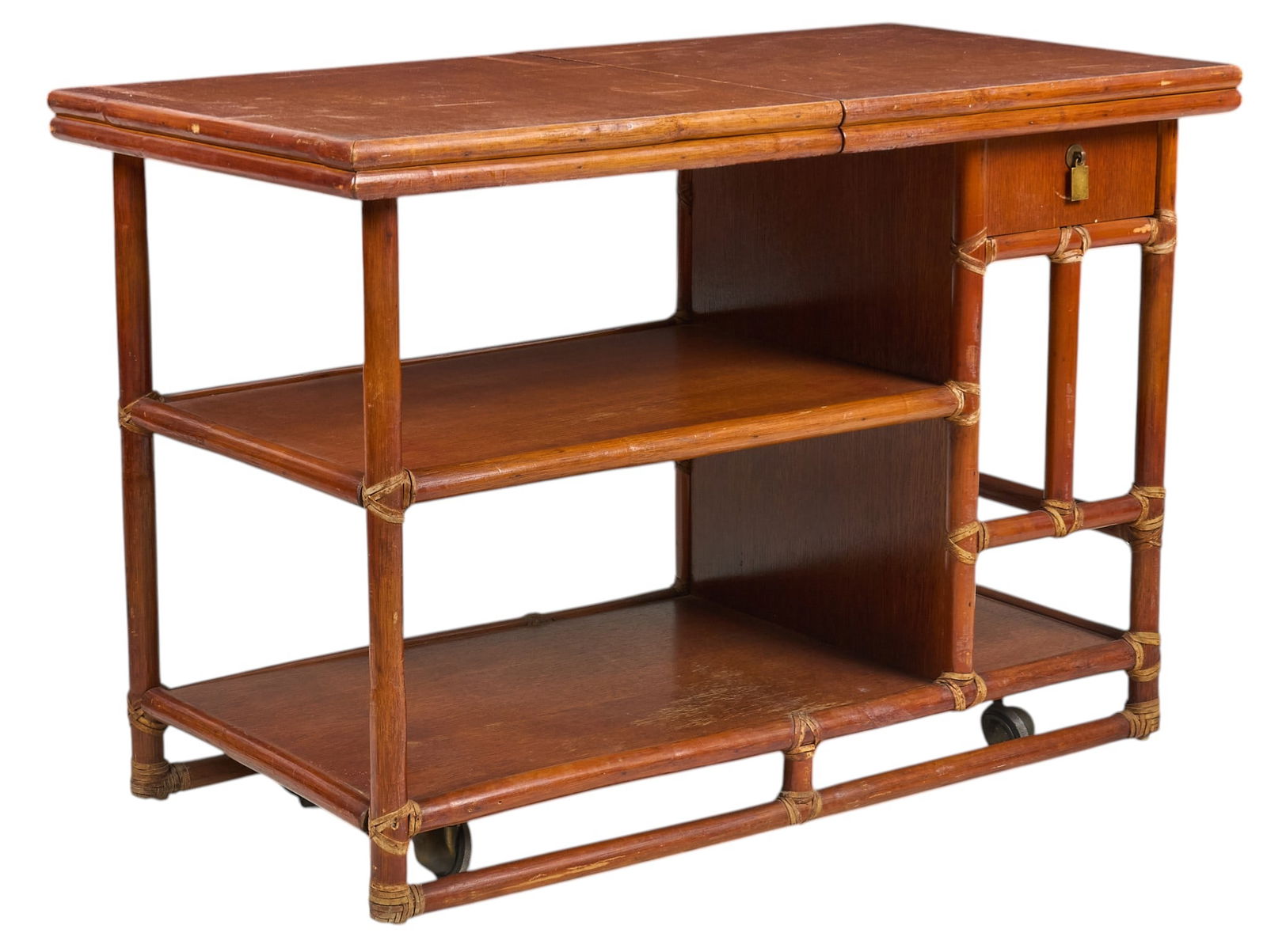 McGuire Faux Bamboo Bar Cart: McGuire mid-century faux bamboo bar cart with slide-out service top, single drawer, and multiple shelves, raised on casters, and marked with McGuire metal tagheight 30 in. x width 44 in. x depth 23