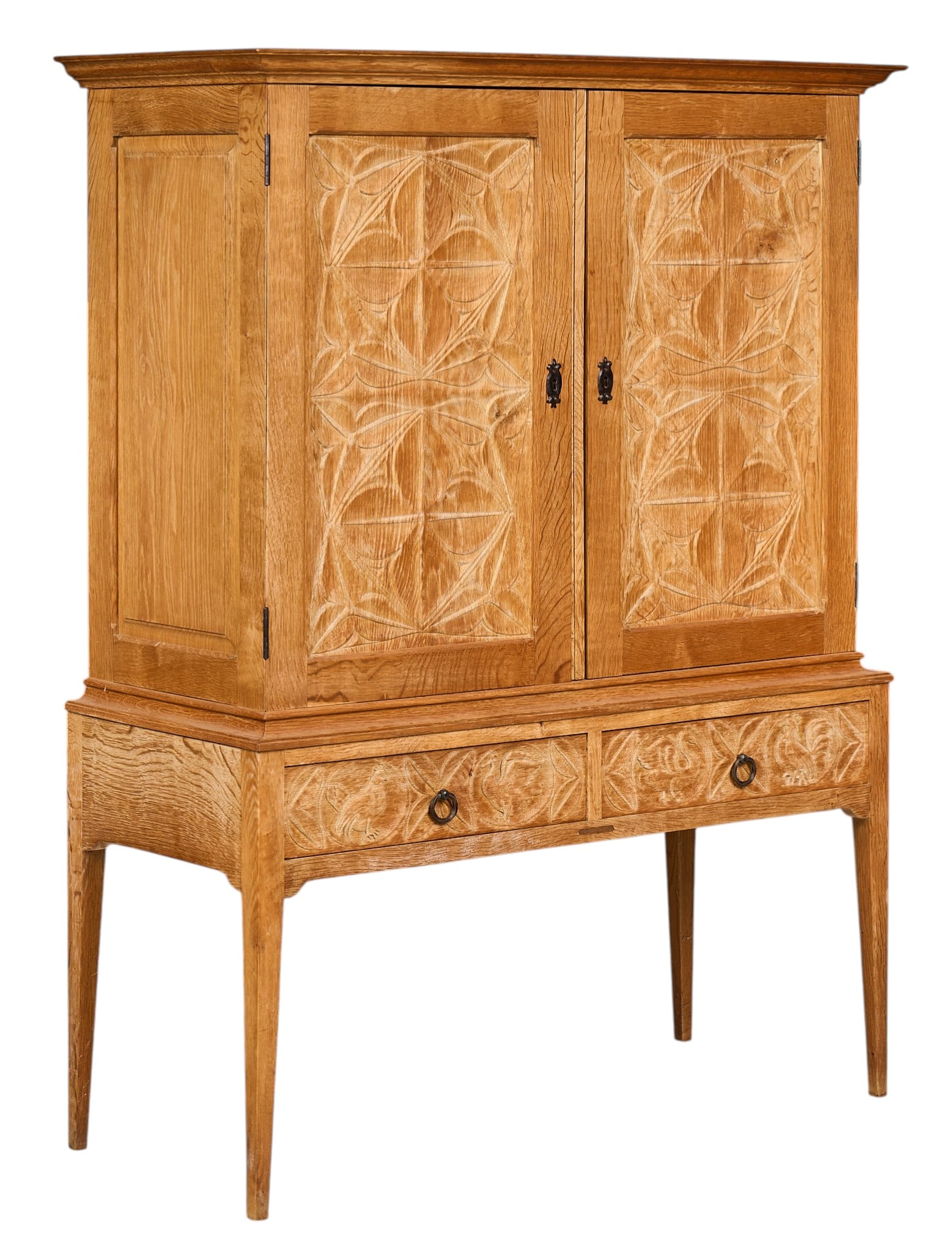 Danish Mid-Century Cabinet: Danish mid-century cabinet with pair of decoratively carved doors that open to interior with adjustble shelves, and two drawers with concealed bottoms, with iron hardwareheight 58.5 in. x width 44
