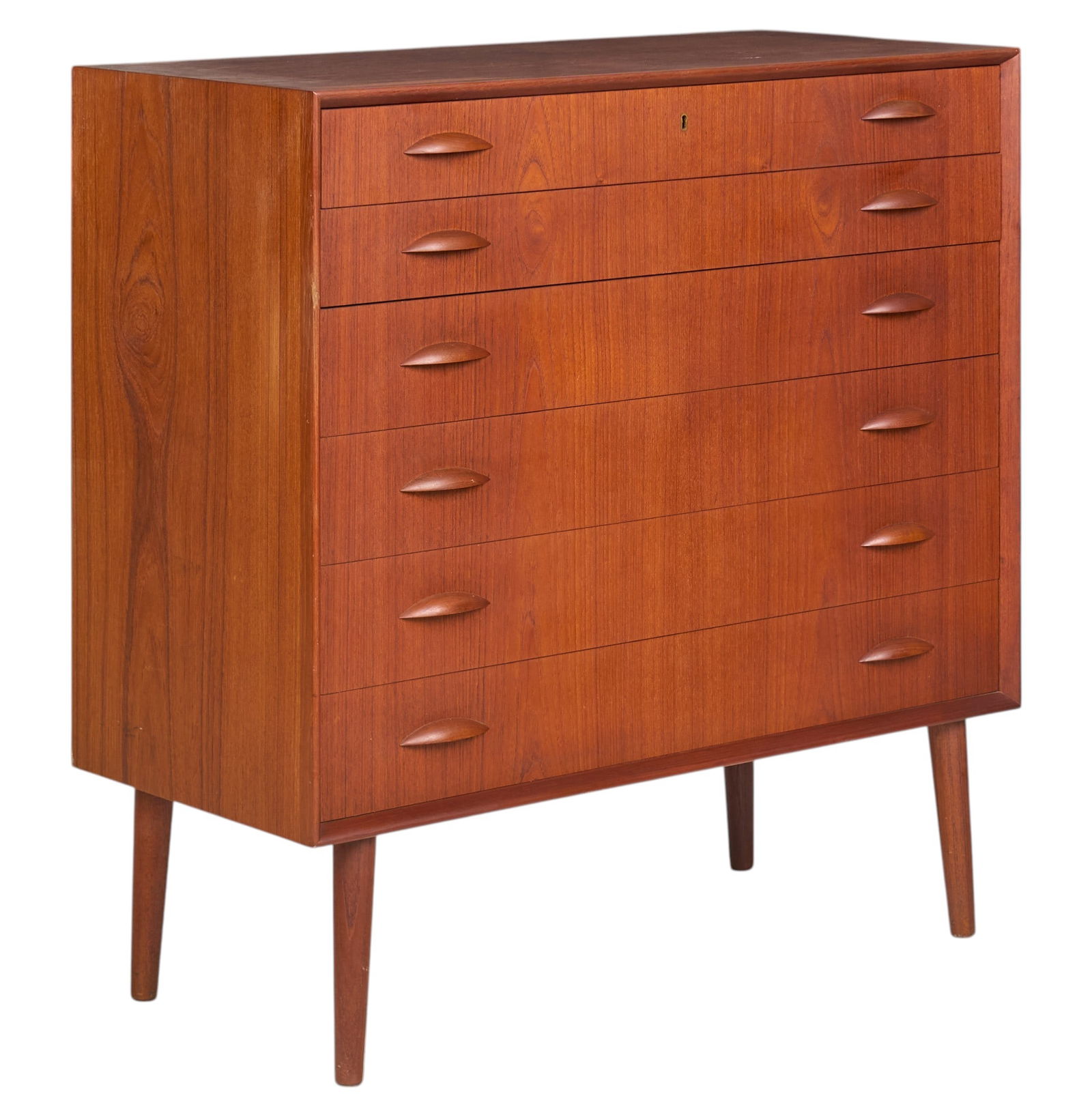 Danish Mid-Century Dresser: Danish mid-century dresser with six flush drawers with wooden pulls, supported on pin legs, with key for top drawerheight 40 in. x width 39.5 in. x depth 17.75 in. 
