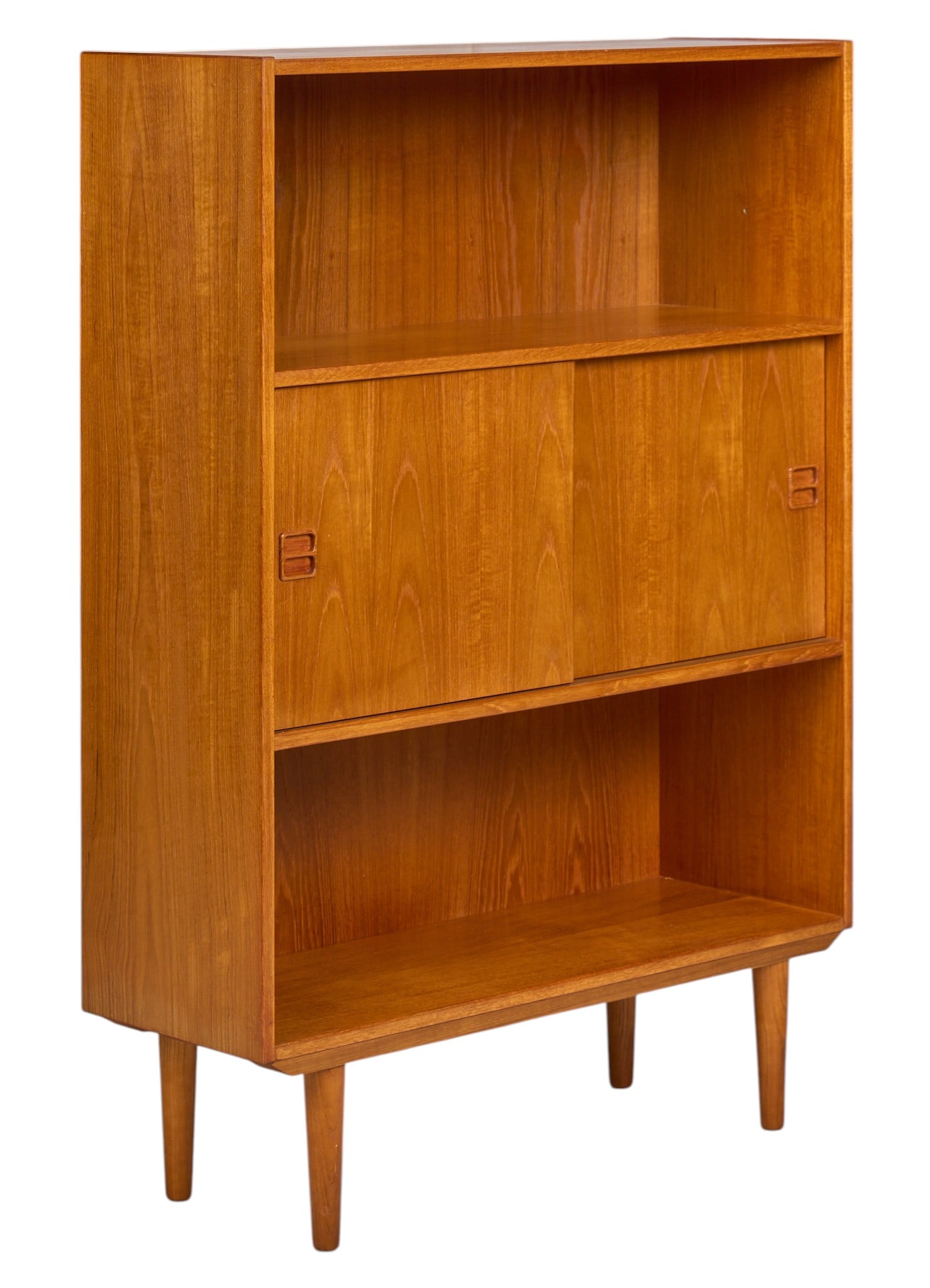 Danish Mid-Century Bookcase: Danish mid-century bookcase with pair of sliding doors featuring interior fitted storage, supported on pin legs height 49.5 in. x width 35.5 in. x depth 12 in. 