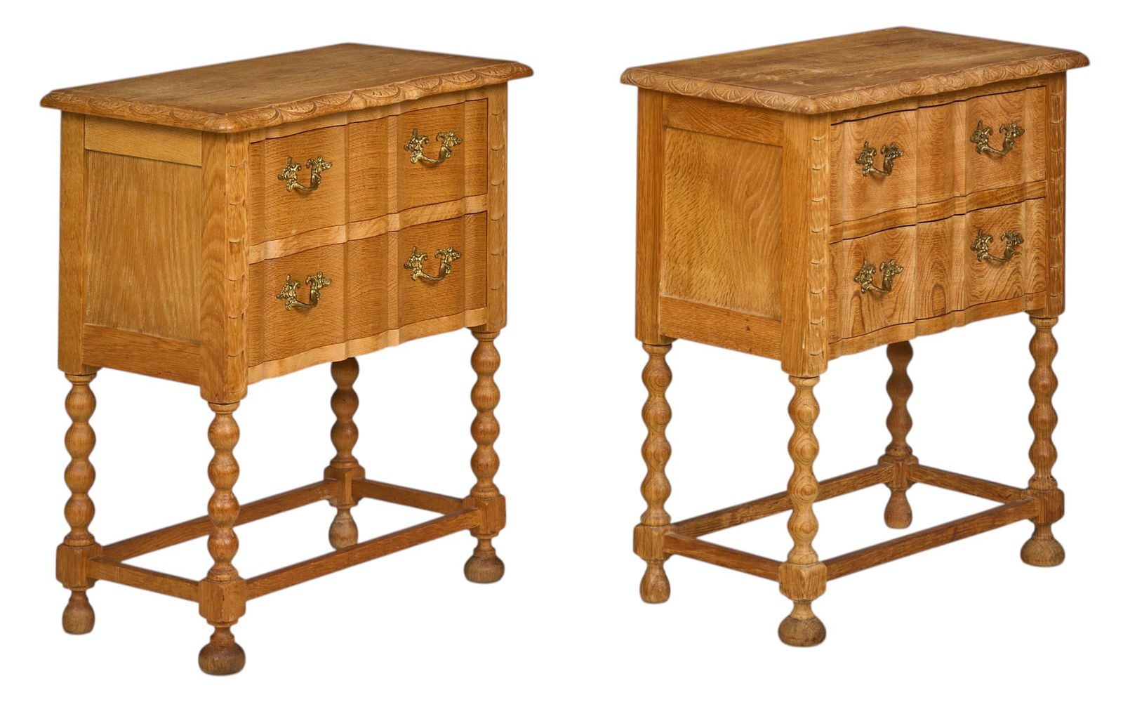 Pair of Danish Mid-Century Side Tables: Pair of Danish mid-century side tables with carved trim, two drawers with decorative pulls, and turned legsheight 24.4 in. x width 22 in. x depth 12 in. / each 