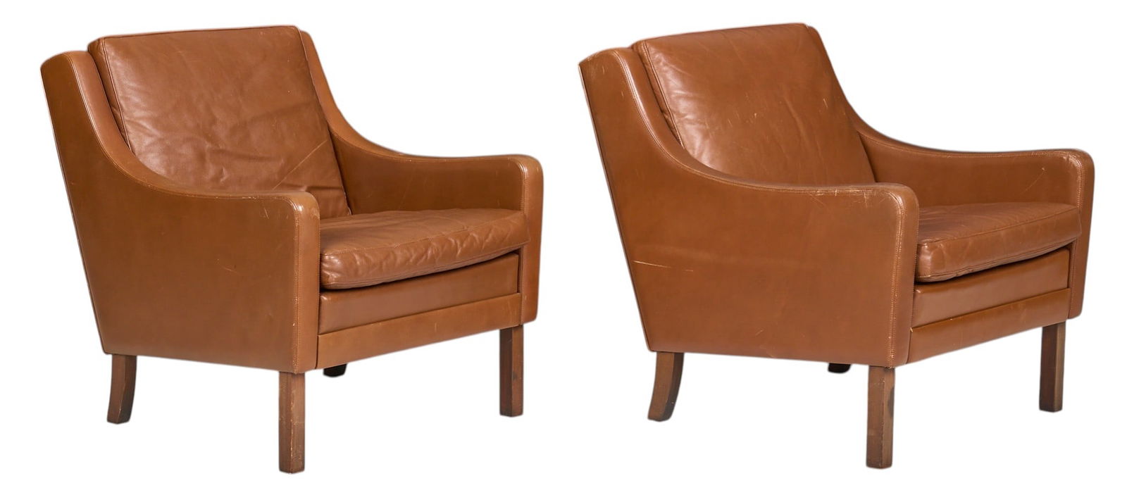 After Børge Mogensen, Pair of Brown Leather Chairs: After Børge Mogensen (Danish, 1914-1972), pair of tan leather lounge chairs, supported on block feetheight 29 in. x width 26 in. x depth 27 in. / each 
