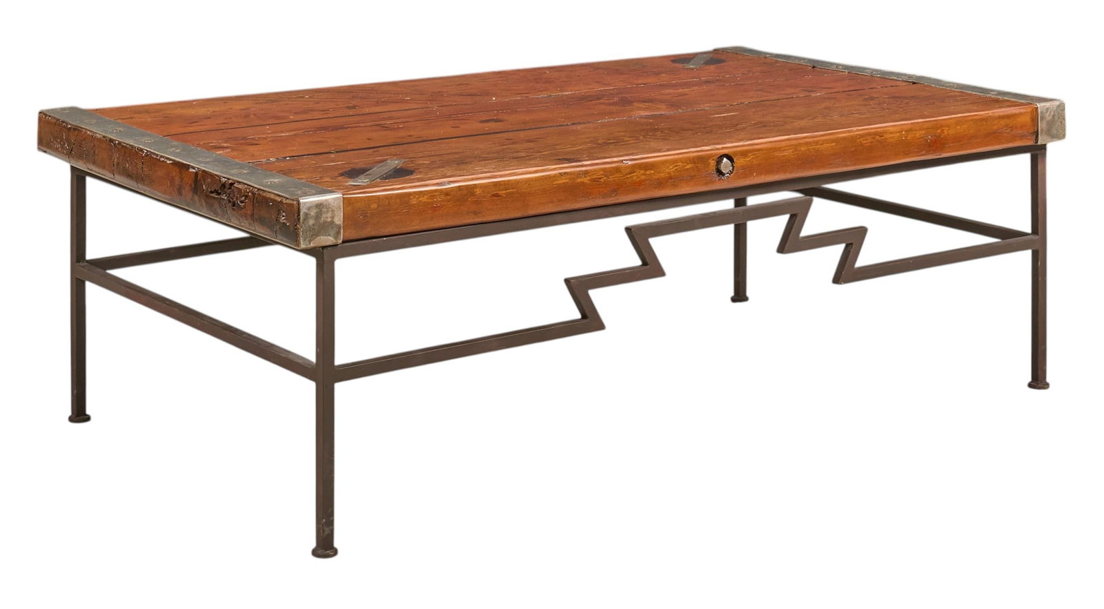 Industrial Style Coffee Table: Industrial style coffee table featuring a plank top with metal trim and corner bracketsheight 19 in. x width 56 in. x depth 33 in.Provenance: Property from a home in San Antonio, Texas