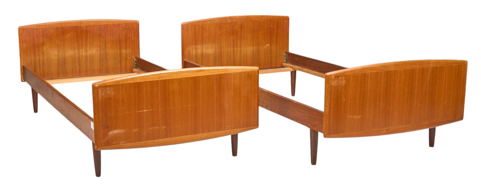 Pair of Danish Twin Beds: Pair of Danish mid-century twin bed frames, with headboard and footboard, on pin legs, marked by makerheight 23 in. x width 37 in. x depth 77 in. / each