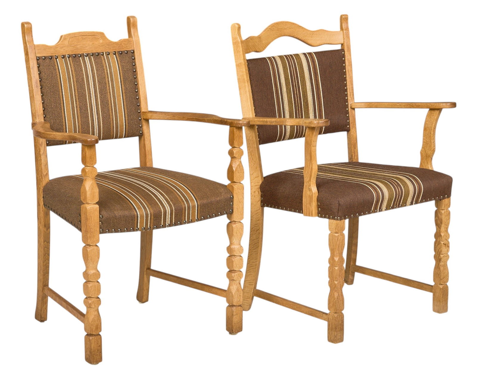 (2) Henning Kjaernulf Mid-Century Armchairs: Two similar Henning Kjaernulf (Denmark) mid-century armchairs with oak frames, and seats with striped brown upholstery, both supported on sculpted block legs height 36 in. x width 25 in. x depth 22 in