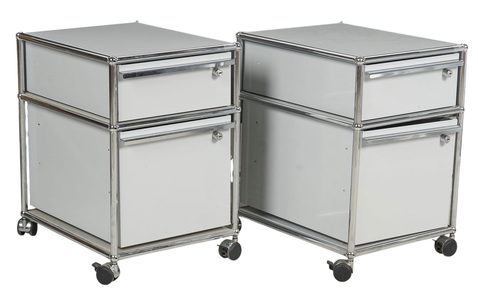 Pair of USM Haller Rolling Storage Pedestals: Pair of Haller white mobile filing pedestals by Fritz Haller for USM Modular, each unit featuring two drawers, with modular design featuring chrome frames, raised on casters, includes