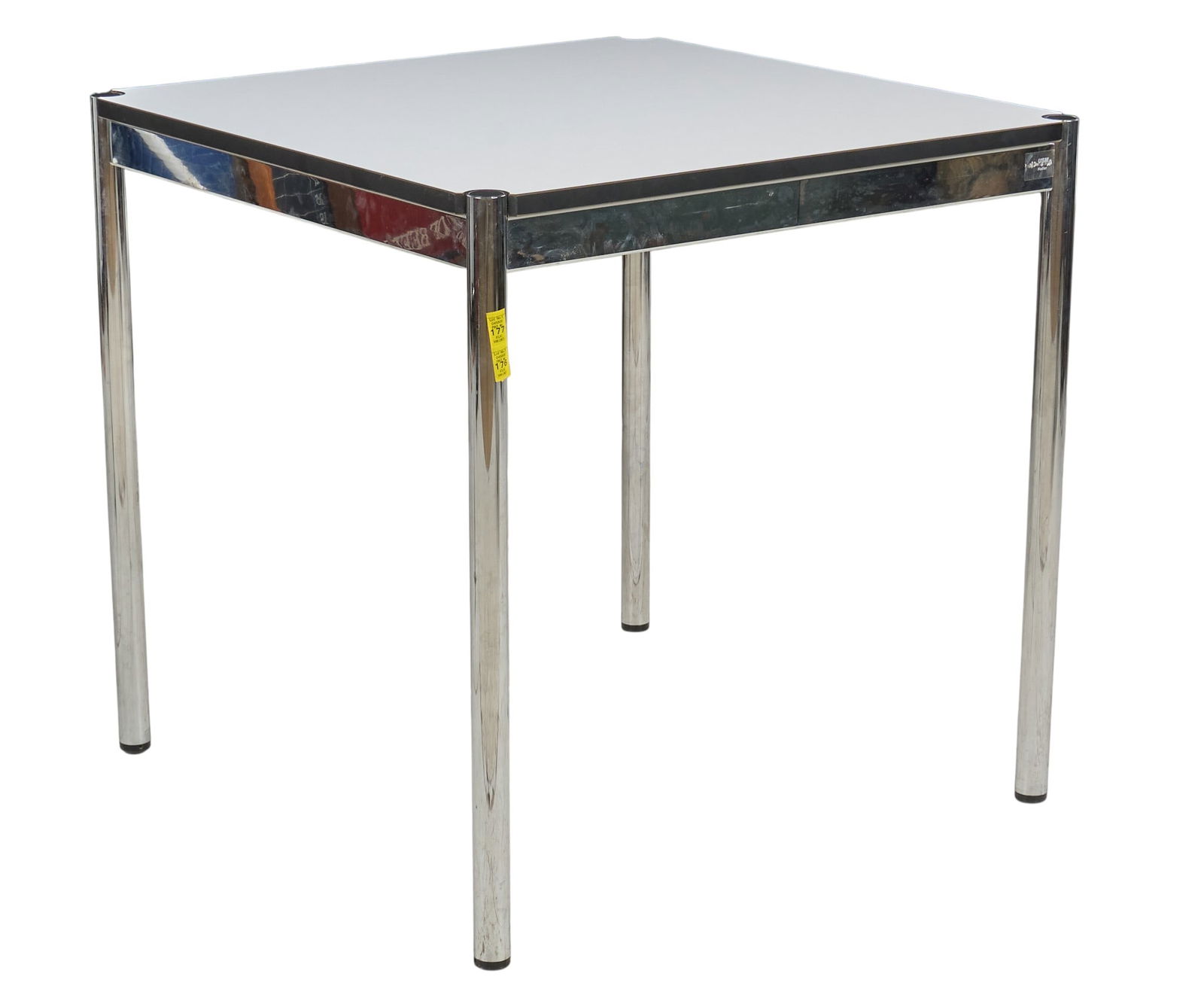 USM Haller Square Table: Haller square table by Fritz Haller for USM Modular, with chrome frame and table legs, and pearl gray white laminate topheight 29 in. x width 30 in. x depth 30 in. Provenance: Property from