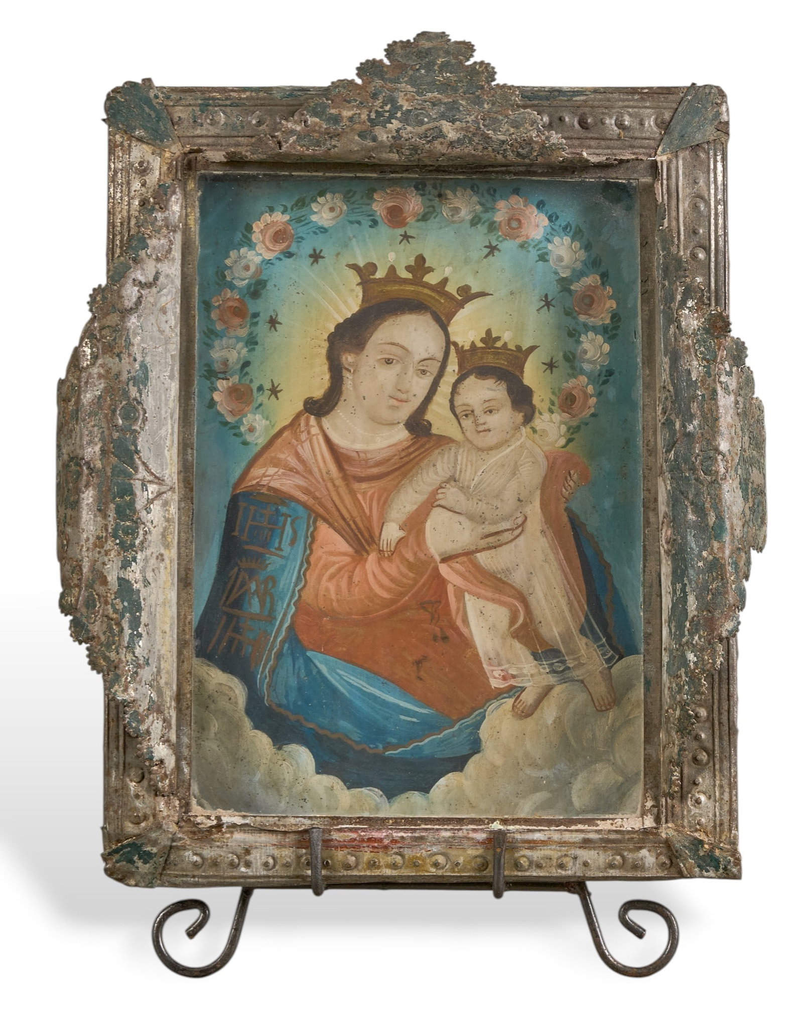 Mexican Retablo, Nuestra Señora del Refugio: Antique Mexican retablo housed in ornate dimensional tin frame and under glass, depicting Nuestra Señora del Refugio (Our Lady of Refuge), holding the Child Jesus, circa 19th century heigh