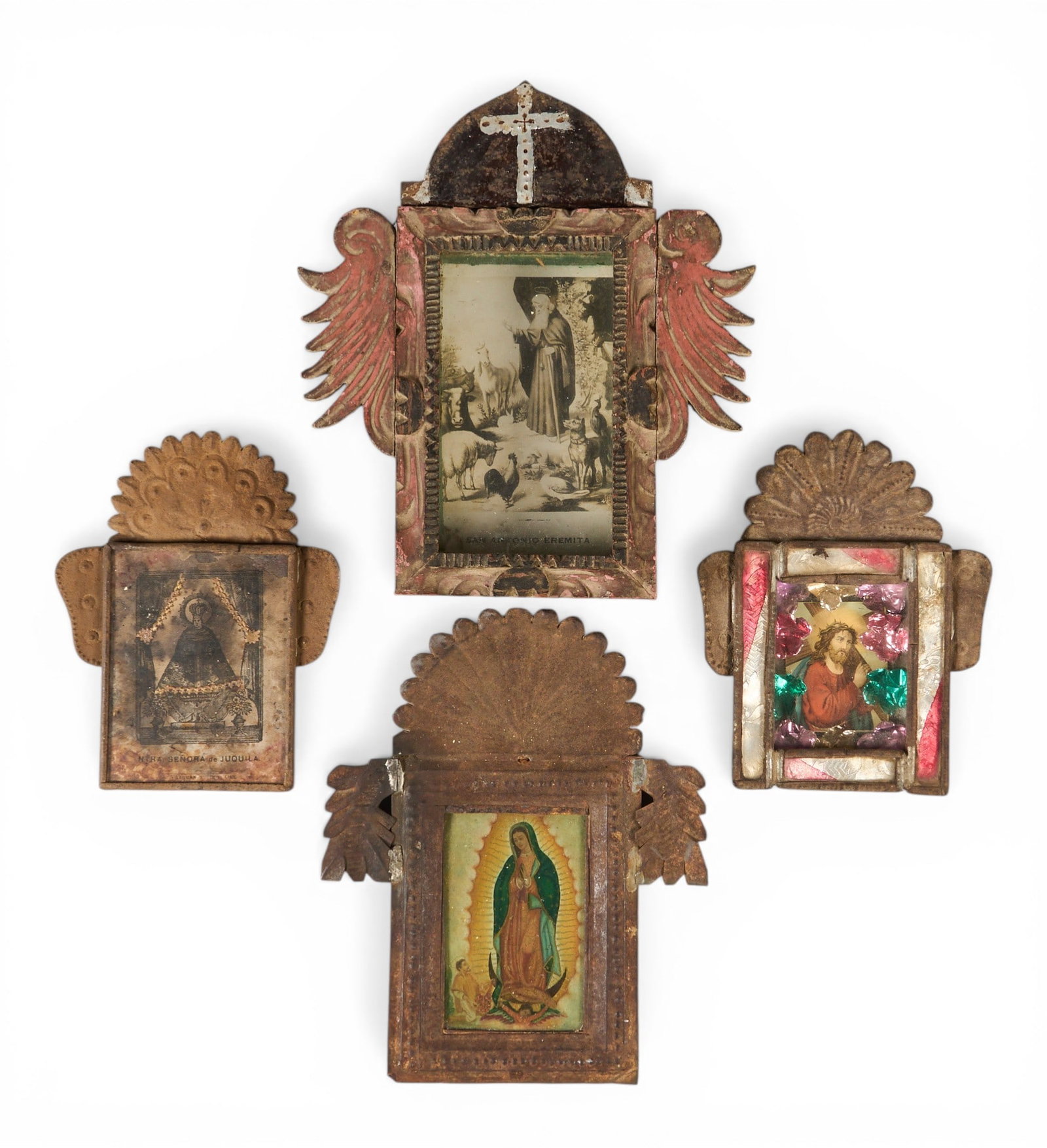 (4) Metal Folk Art Nichos: Collection of four Mexican nichos, each with hand-tooled tin frame housing depicting of religious iconography, circa 20th century height 8.5 in. x width 8 in. x depth 3 in. / largest Prove