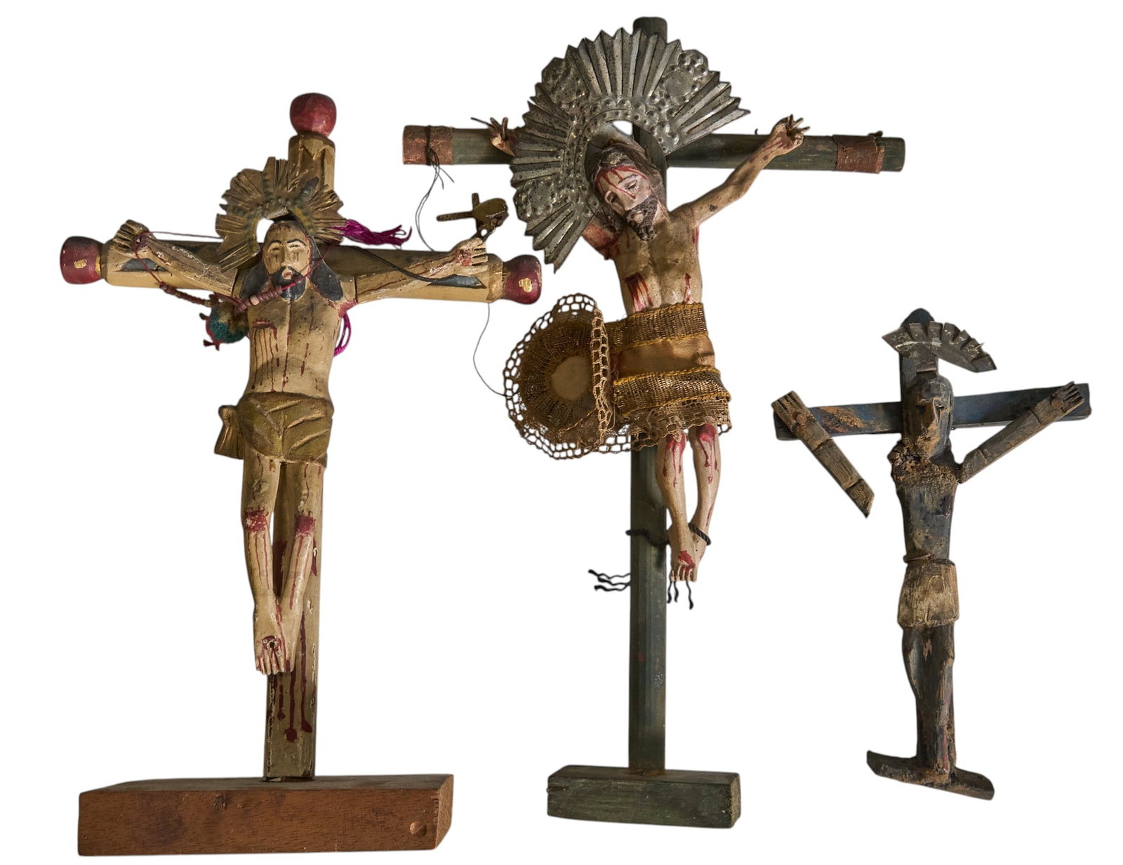 (3) Antique Crucifixes: Three antique hand-carved and painted wooden crucifixes, circa late 19th to early 20th century height 11 in. x width 7 in. x depth 1 in. / largest Provenance: The Estate collection of late teach