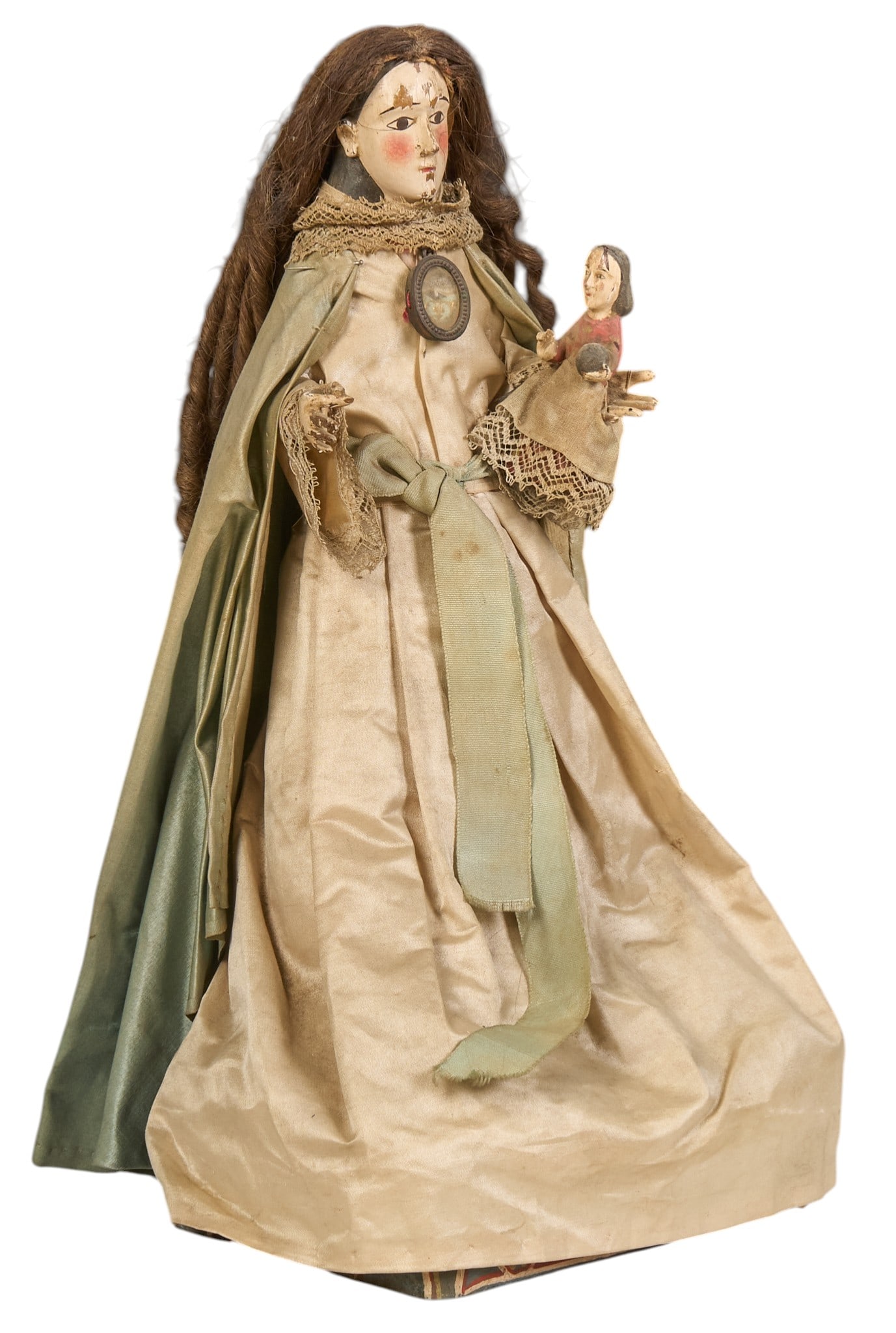 Antique Spanish Colonial Style Madonna: Antique Spanish Colonial style Madonna figure, with cloth dress and curled hair, circa 19th century height 14 in. x width 7 in. x depth 5 in. Provenance: The Estate collection of late teacher an
