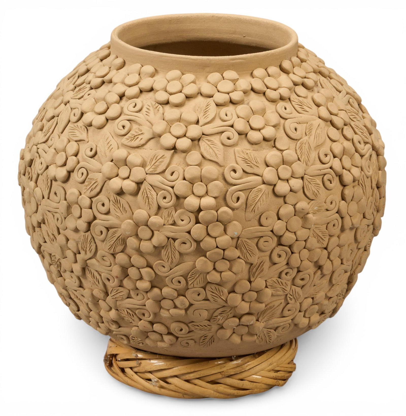 Vintage Oaxacan Vase: Vintage Oaxacan vase with hand-modeled floral motifs, supported on woven reed stand, circa 20th century height 10.5 in. x width 12 in. x depth 12 in. Provenance: The Estate collection of late te