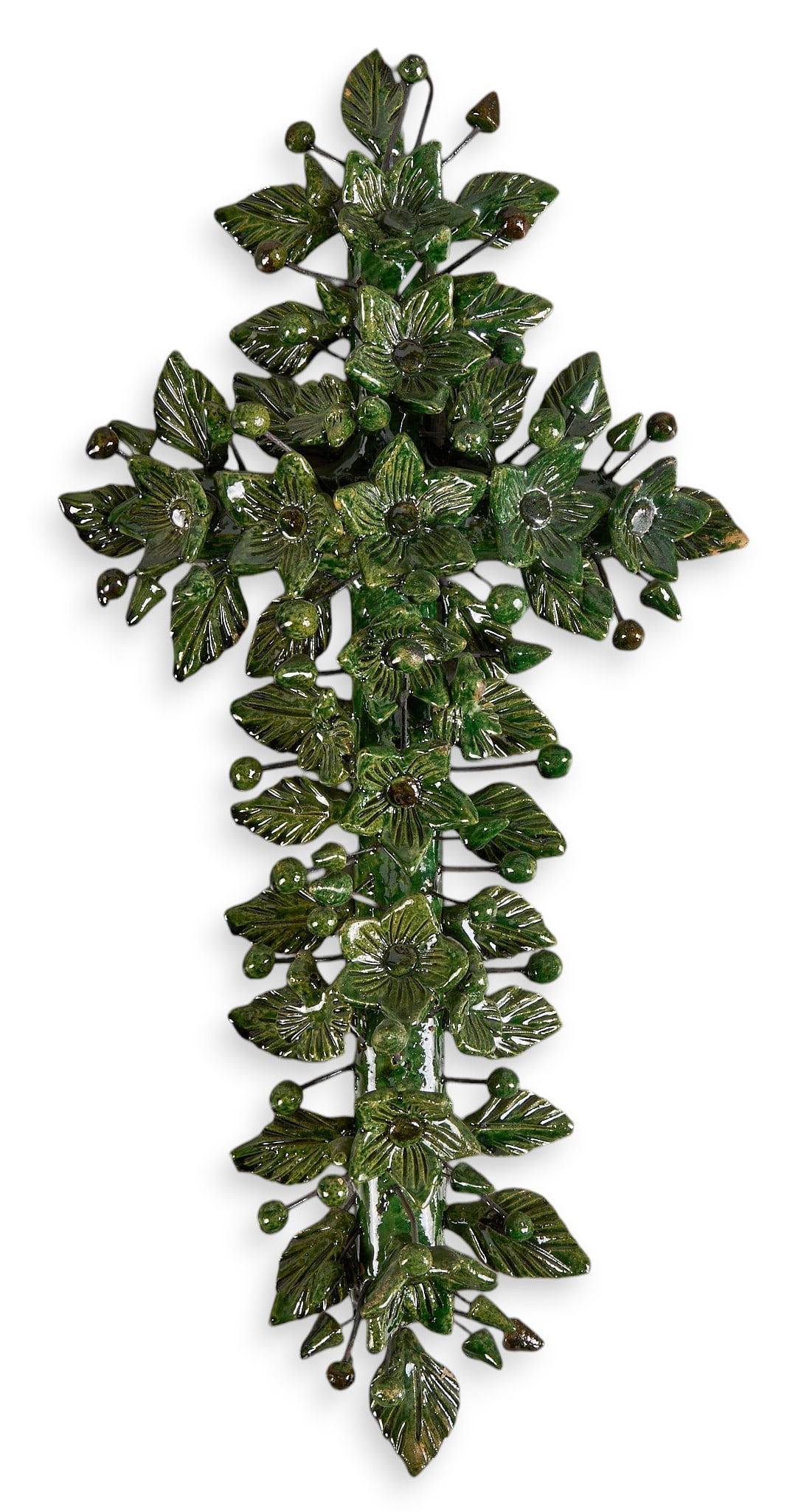 Mexican Ceramic Cross: Hand-made Mexican folk art ceramic cross with floral and foliate design, dark green glazing, and metal wire hardware, wired on back for hanging, circa 20th century height 17.5 in. x width 1