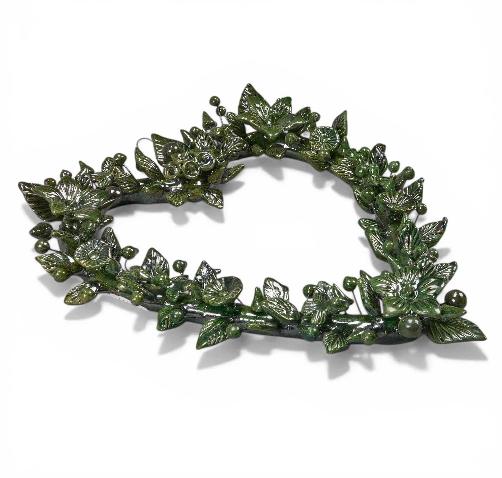 Vintage Michoacan Heart Sculpture: Vintage hand-modeled and glazed Michoacan hanging ceramic sculpture, with botanical motifs, circa 20th century height 15 in. x width 12 in. x depth 2 in. Provenance: The Estate collection of lat