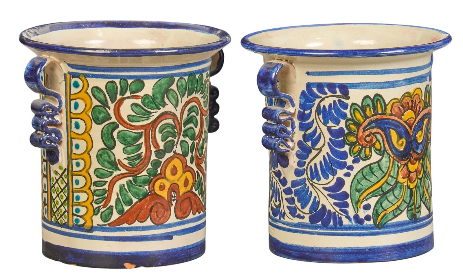 Pair of Mexican Talavera Vases: Pair of hand-made and painted Mexican Talavera vases with ribbon-form handles height 7 in. x diameter 6.5 in. / largest Provenance: The Estate collection of late teacher and humanitarian Douglas Rhode