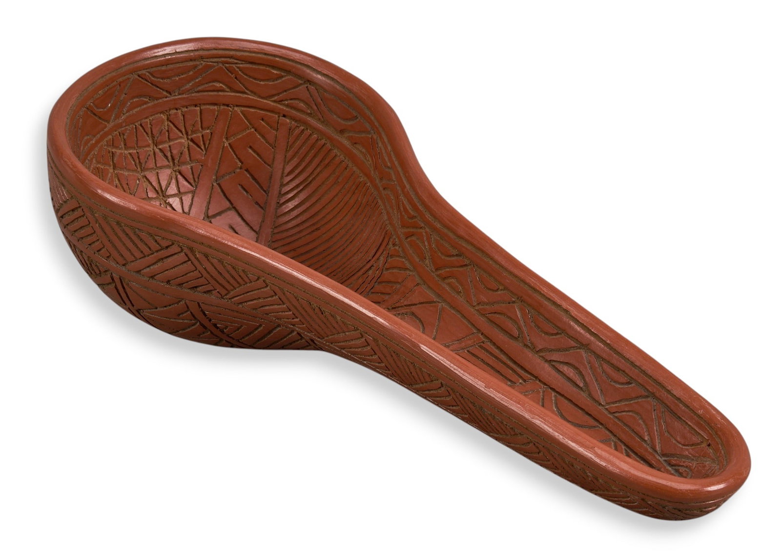 Mexican Wooden Spoon: Hand-tooled Mexican wooden spoon with red finish, circa 20th century height 4 in. x width 6 in. x depth 14.5 in. Provenance: Property from a home in Leon, Guanajuato, Mexico