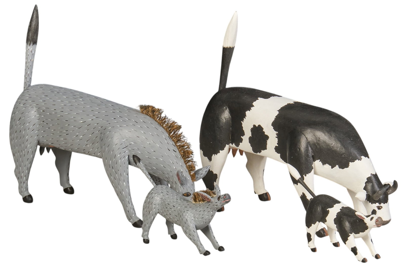 Gabino Reyes, (4) Cow and Donkey Alebrije: Collection of four Gabino Reyes (Oaxaca, 20th century) hand-carved and painted alebrjie sculptures depicting cow and donkeys, with the larger examples featuring carved depiction of la Virgen