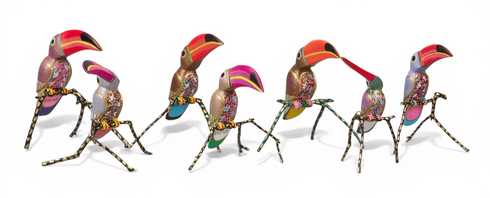 Maria Jimenez Ojeda, (7) Toucan Alebrije Sculptures: Collection of seven Maria Jimenez Ojeda (San Martín Tilcajete, Oaxaca, 20th century) hand-carved and painted toucan alebrije sculptures, with meticulously hand-painted floral designs, supported