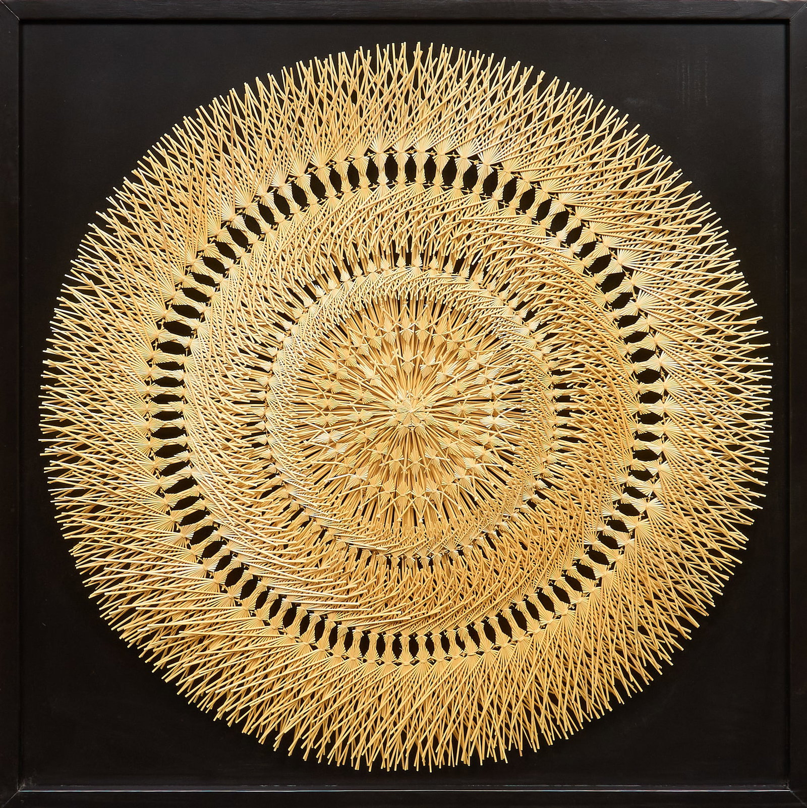 Popotillo Estrella Wall Hanging: Hand-made popotillo "estrella" straw marquetry wall hanging, composed of straw arranged in radial bands, alternating chevron borders, and lattice rings forming a star pattern,