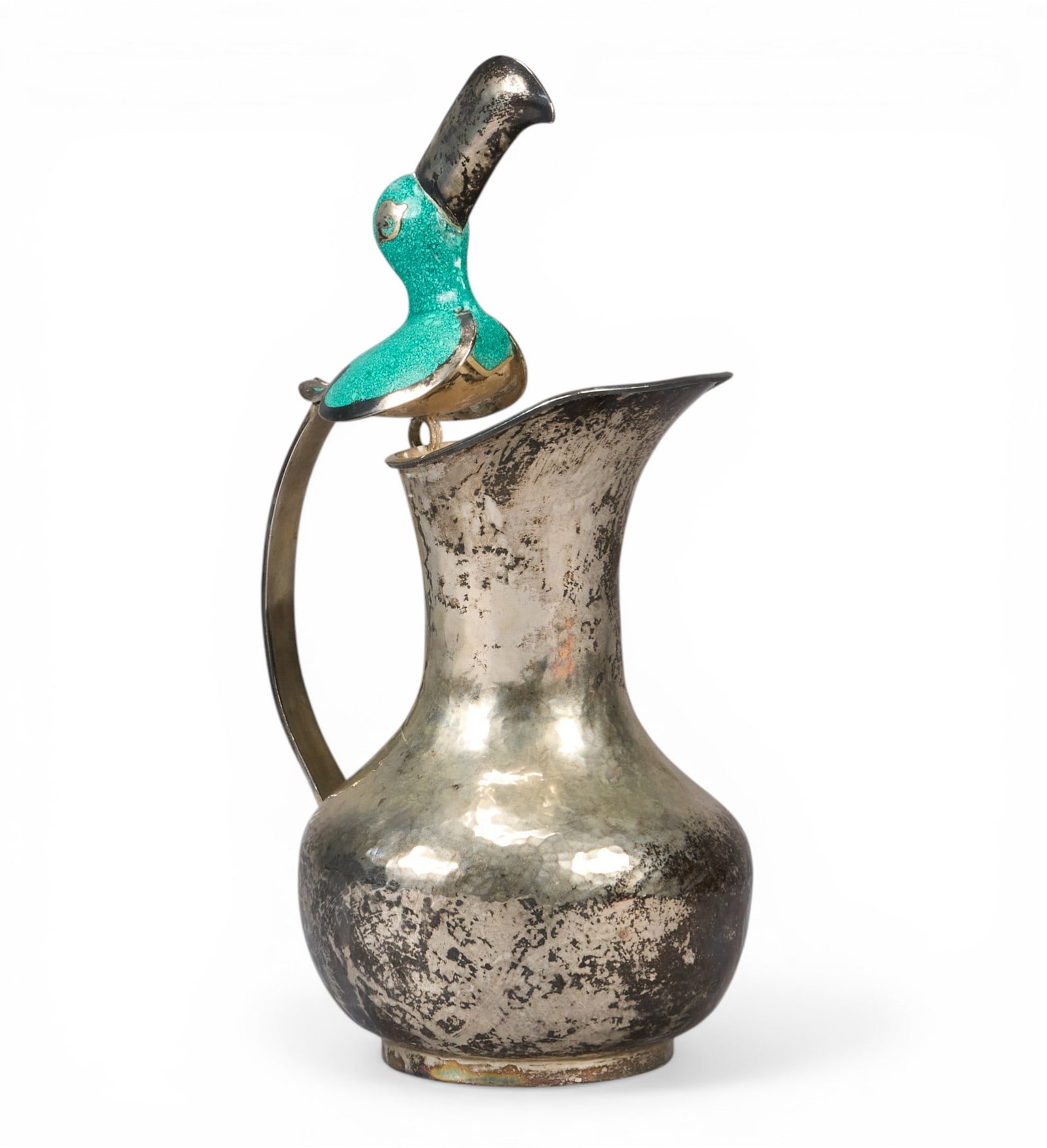 Los Castillo Style Toucan Pitcher: Los Castillo style copper pitcher, with toucan detail to top of handle, marked "Mexico Taxco" height 16 in. x width 7 in. x depth 9 in. Provenance: Property from a home in Boerne, Texas