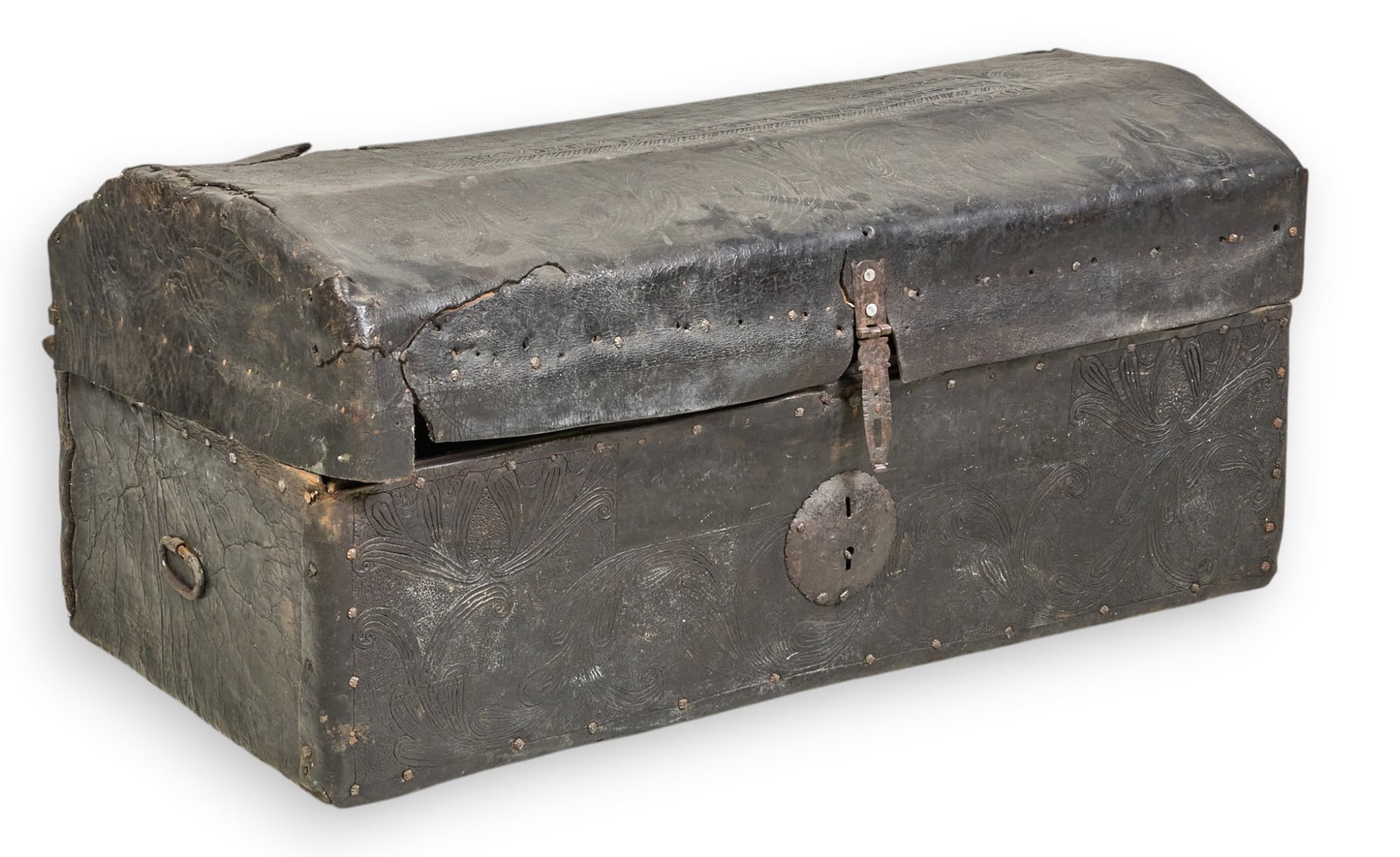 Antique Mexican Trunk: Antique Mexican trunk, with exterior lined with hand-tooled black leather, and iron hardware, circa late 19th to early 20th century height 18 in. x width 42 in. x depth 22 in. Provenance: Property fro