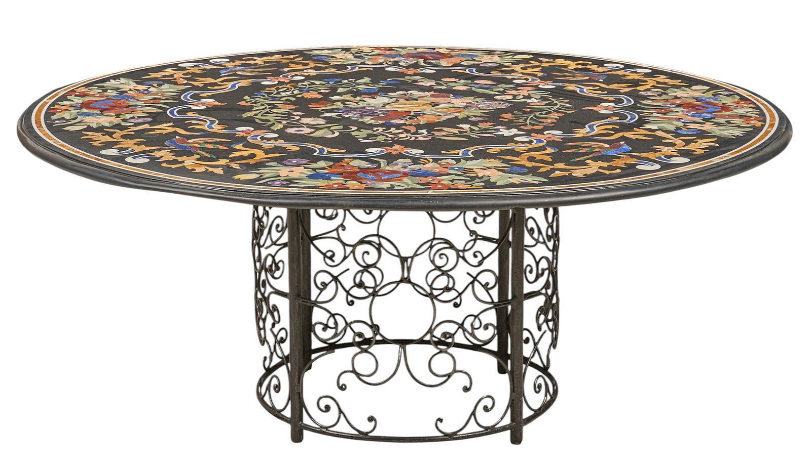 Inlaid Stone Table with Scrolled Metal Base: Round table with pietra dura inlay to top, featuring floral and bird motifs, supported by a scrolled metal base height 25 in. x diameter 60 in. Provenance: Property from a home in San Antoni