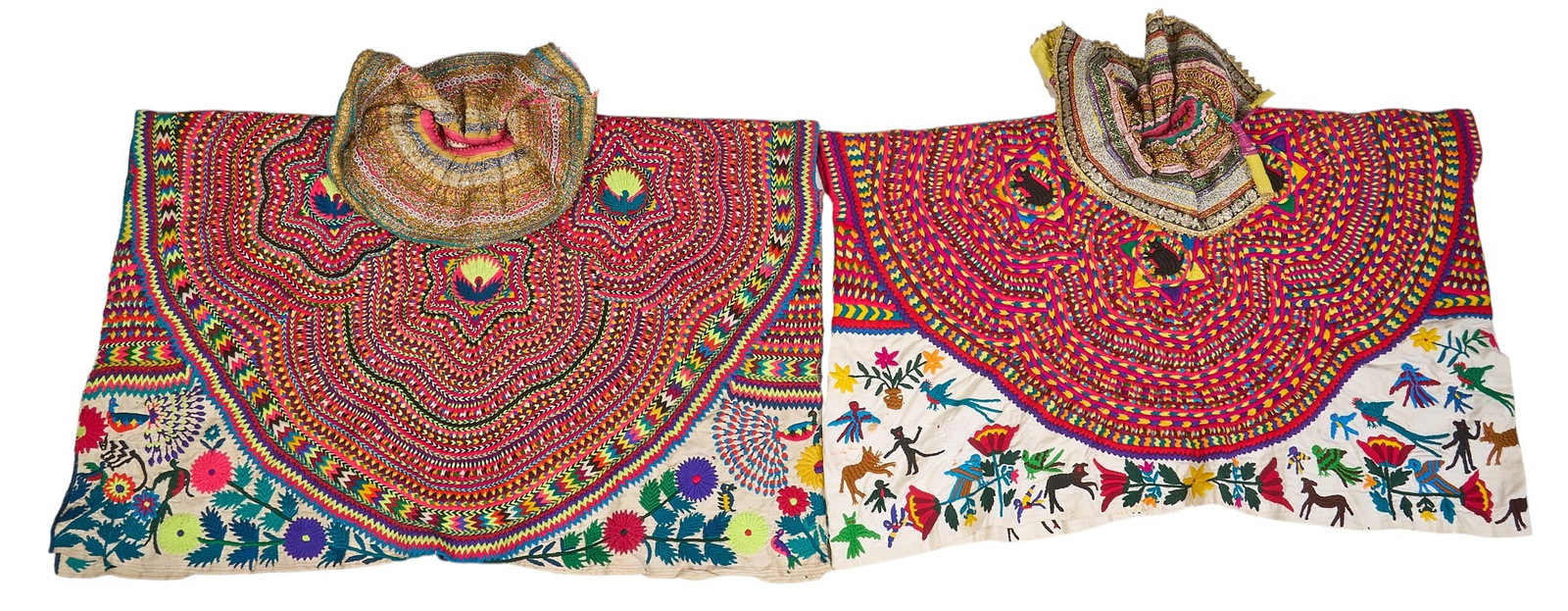 (2) Embroidered Guatemalan Huipils: Two embroidered Guatemalan huipils, with assorted flora and fauna motifs in vibrant colors, with thick collars height 48 in. x width 30 in. / largest Provenance: The Estate collect