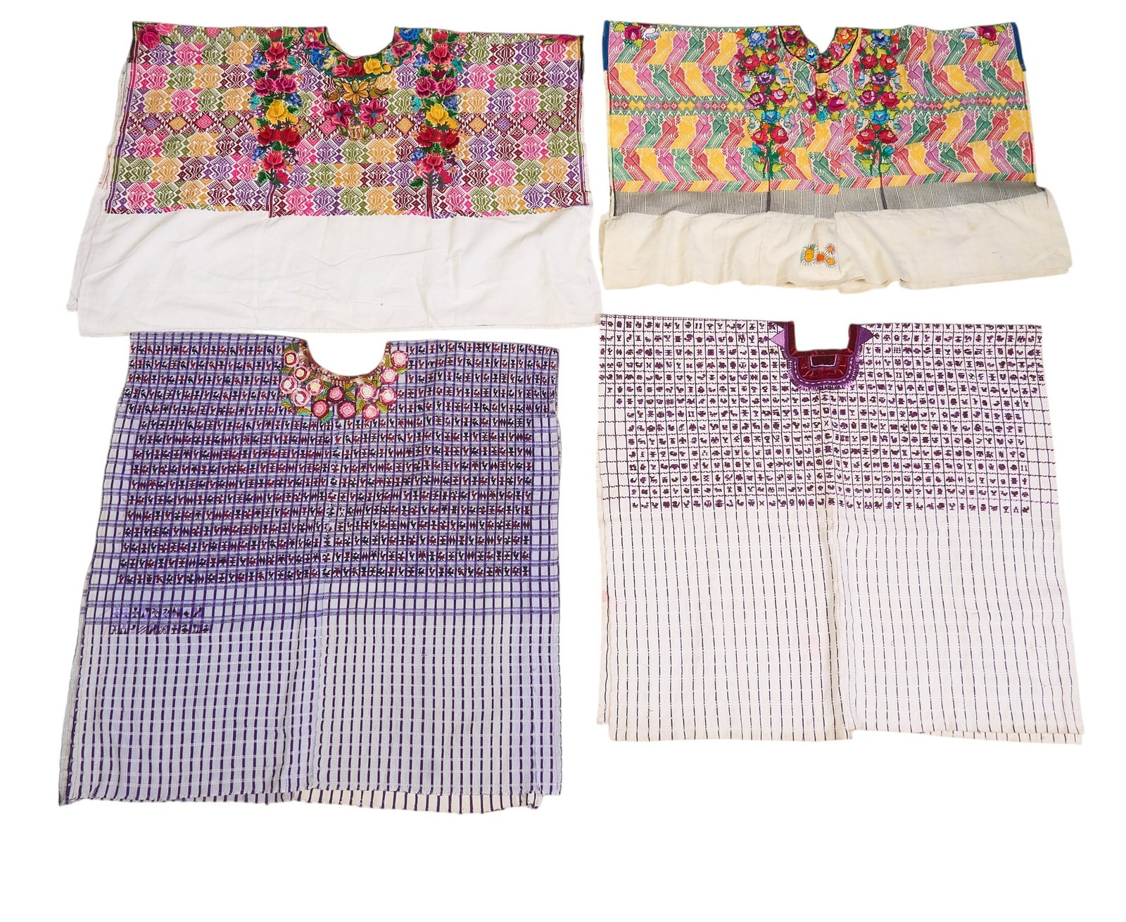 (4) Embroidered Guatemalan Huipils: Collection of four embroidered Guatemalan huipils, with floral and folk art motifs in vibrant colors height 36 in. x width 35 in. / largest Provenance: The Estate collection of late tea