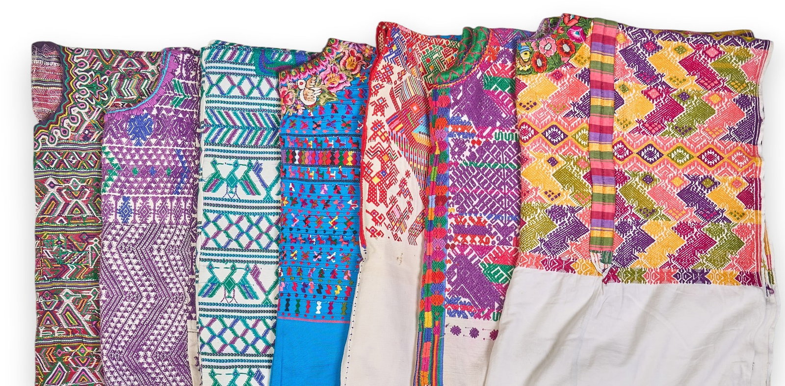 (7) Embroidered Guatemalan Huipils: Collection of seven embroidered Guatemalan huipils, featuring floral and geometric motifs height 44.5 in. x width 44 in. / largest