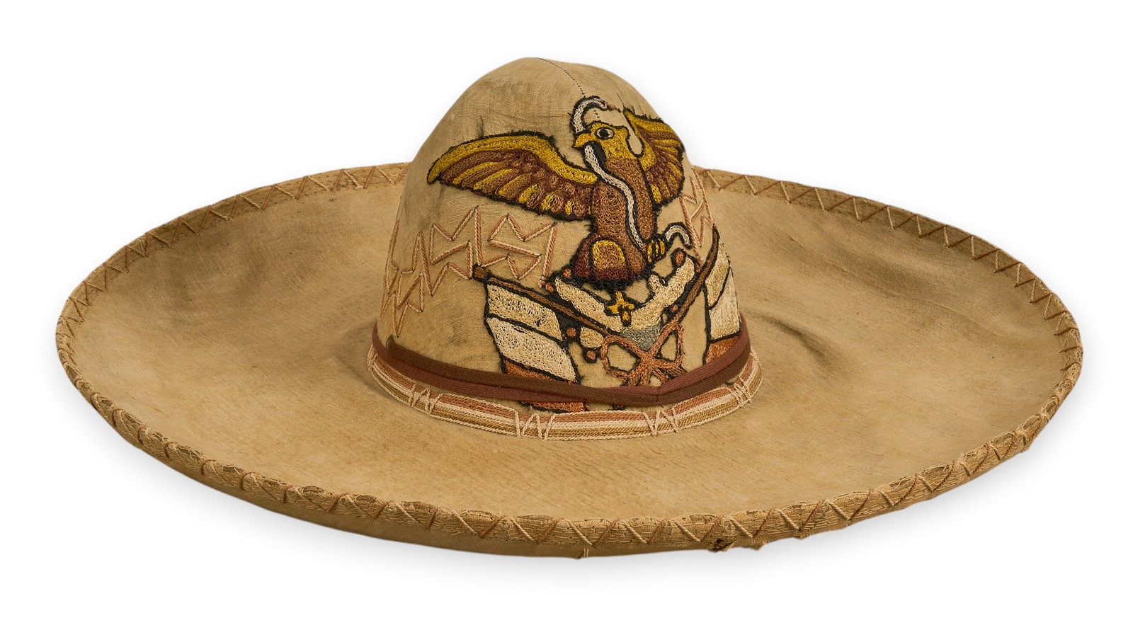 Vintage Charro Hat with Eagle Design: Vintage charro hat, constructed with cloth over a straw base, featuring an embroidered eagle design on the crown and rose details on the brim, circa 1940s height 6 in. x width 17.5 in. x depth 19