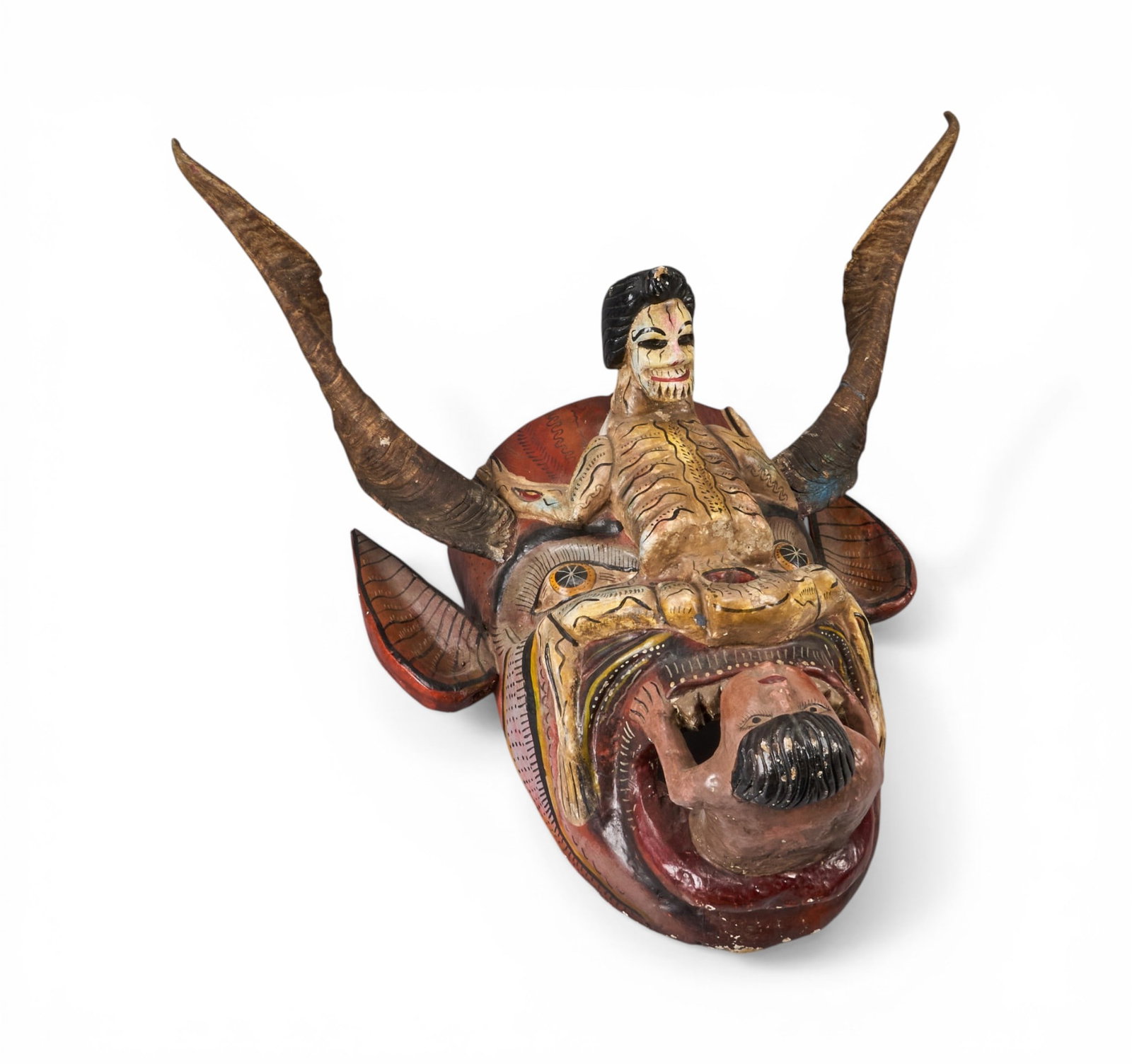Large Mexican Folk Art Mask: Large Mexican folk art mask, titled "The Devil's Devil", polychrome and wooden composition, with long horns and three heads height 21 in. x width 31 in. x depth 23 in. Provenan