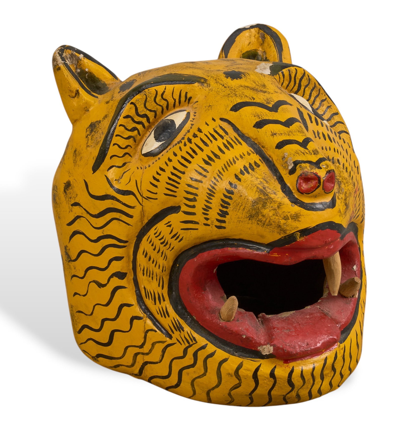 Mexican Folk Art Jaguar Dance Mask: Mexican hand-carved and painted wooden jaguar mask, featuring yellow and black stripes, red mouth with unpainted wooden teeth height 7.5 in. x width 8.5 in. x depth 8.75 in.