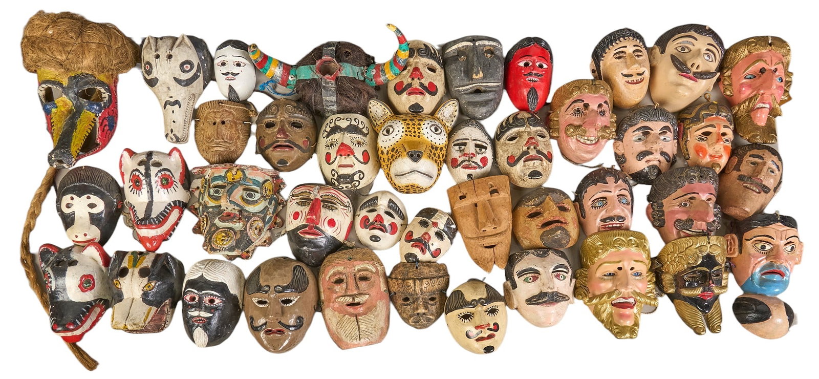 (41) Folk Art Dance Masks: Collection of forty-one hand-made and painted folk art dance masks, with multiple styles, and varying ages height 13 in. x width 15 in. x depth 19 in. / largest Provenance: The Estate colle