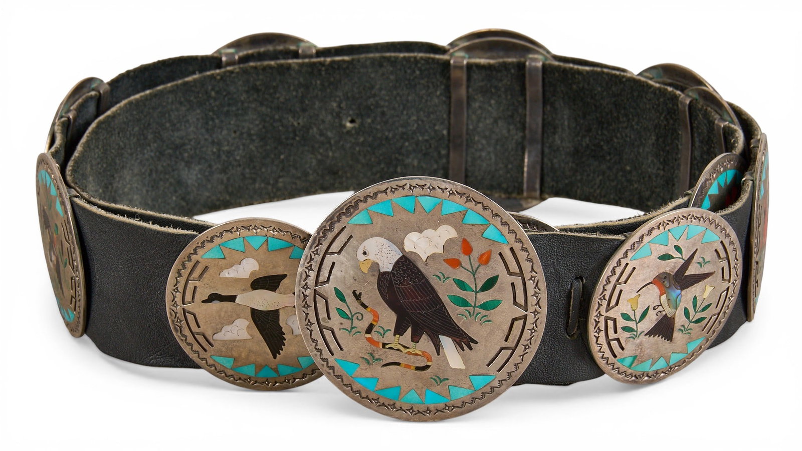 S&E Guardian, Zuni Sterling & Multi-Stone Inlay Concho Belt: Sammy & Esther Guardian, Zuni sterling silver concho belt, with twelve conchos and buckle on black leather belt, each concho set with multi-stone inlay depicting various bird motifs, signed &