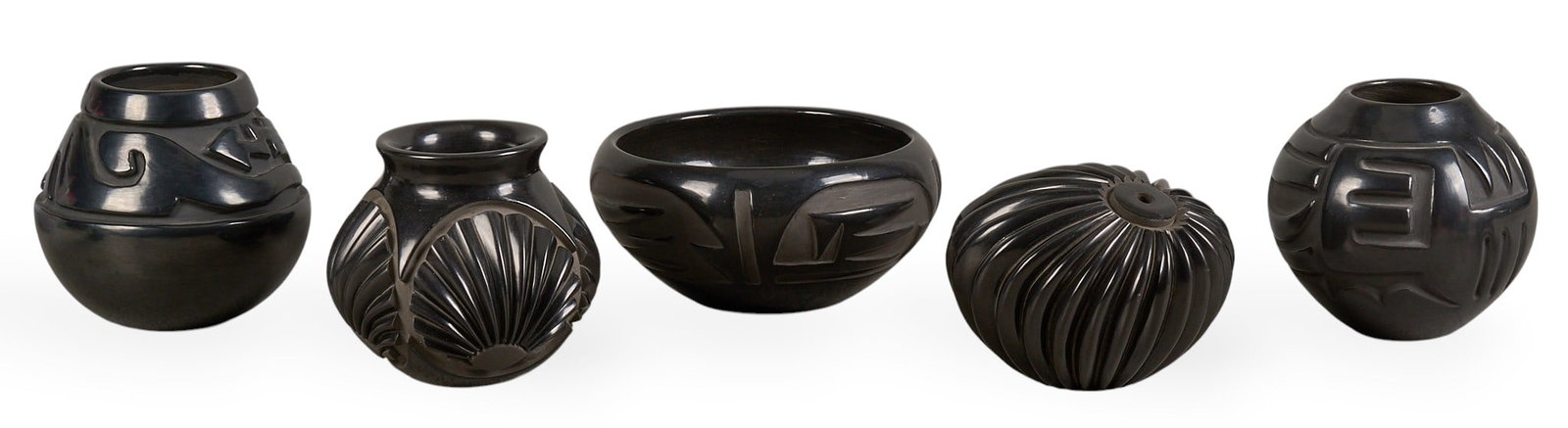 (5) Santa Clara Blackware Pottery Vessels: Collection of five Santa Clara blackware pottery vessels, in various shapes and sizes featuring geometric motifs, several signedheight 6.5 in. x diameter 7 in. / largestProvenance: Property from the