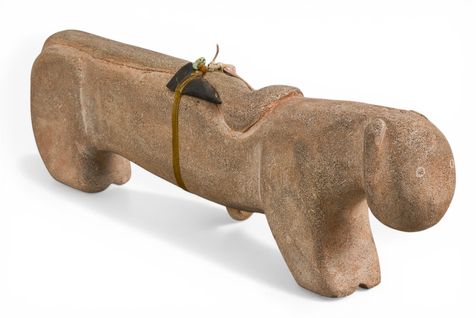 Salvador Romero, Stone Fetish Carving: Salvador Romero (Cochiti Pueblo) stone bear fetish carving, with arrowhead, turquoise and coral beaded detailsheight 6 in. x width 19.5 in. x depth 3 in.Provenance: Property from the personal archive