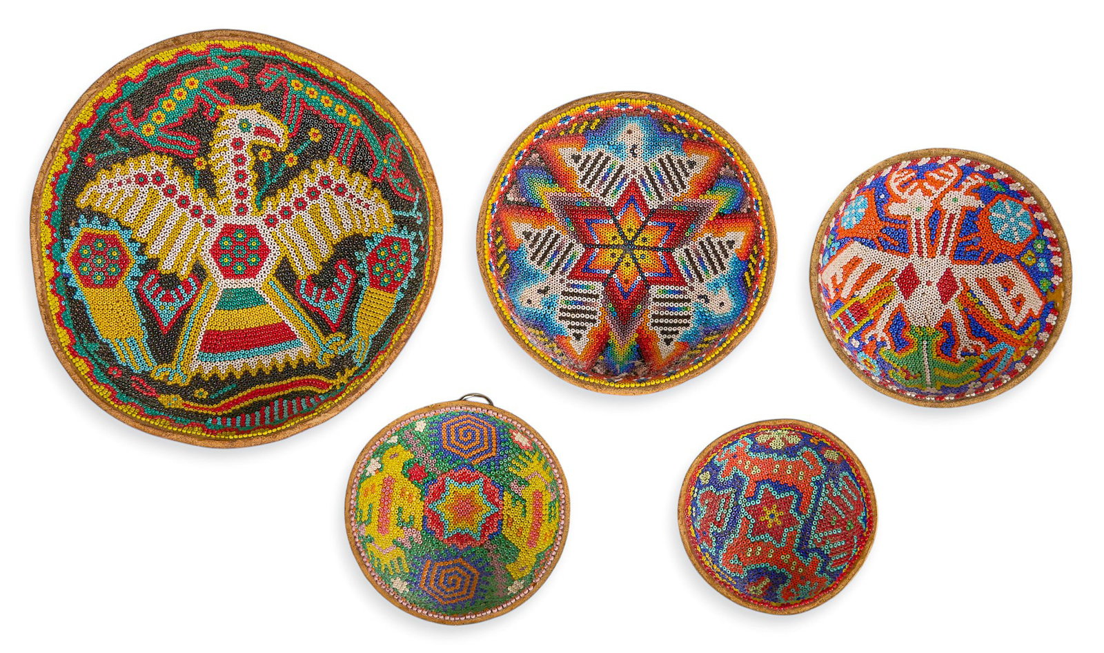 (5) Huichol Beaded Gourd Bowls: Collection of five Huichol beaded gourd bowls, in various sizes and featuring intricate beadwork designs in vibrant colorsdiameter 7 in. x depth 1.5 in. / largestProvenance: Property from the