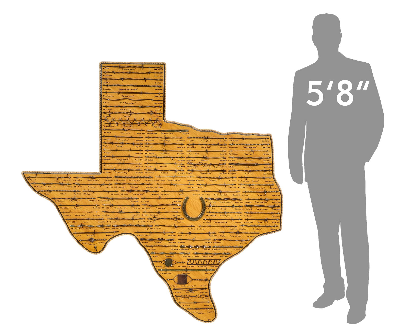 Monumental Texas Barbed Wire Display: Impressive Texas shaped barbed display, with numerous labeled examples height 58 in. x width 55.5 in. Provenance: Property from a home in Ingram, Texas