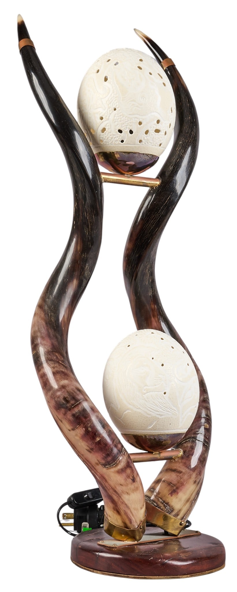 Kudu and Ostrich Table Lamp: Exotic table lamp made from kudu horns, and tooled ostrich eggs, untested height 27.5 in. x width 10.5 in. x depth 8.5 in. Provenance: Property from the Estate of Robert A. "Bob" Funk 