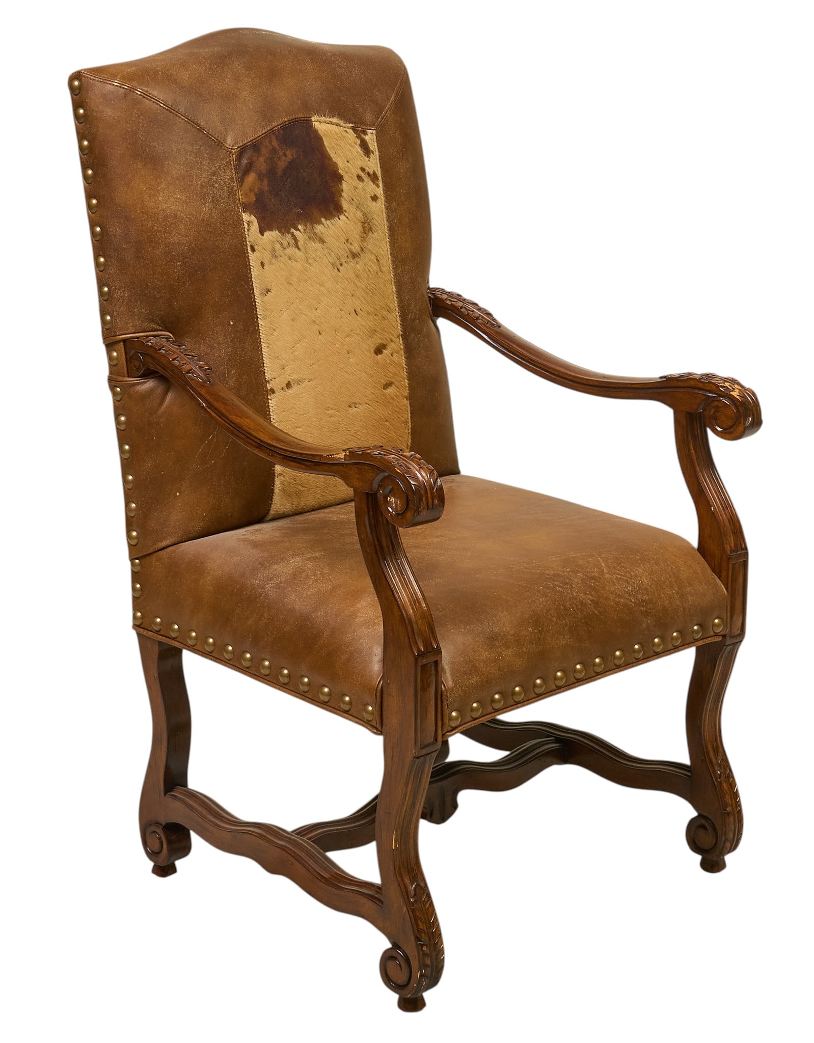 Leather and Hide Armchair: Ranch style armchair with carved frame, and leather and hair on hide upholstery with metal nail trim height 44 in. x width 25 in. x depth 23 in. Provenance: Property from the Estate of Robert A.