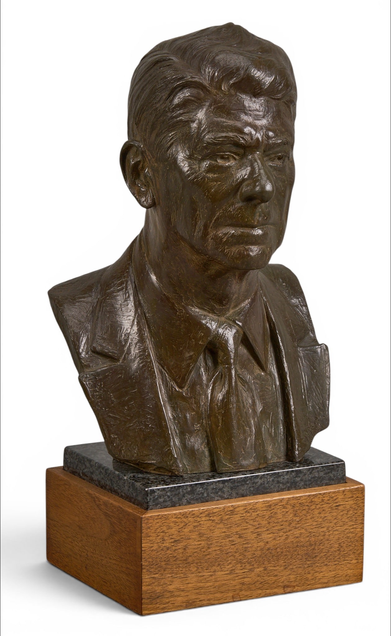 Edward Fraughton, "Ronald Reagan Bust": Edward James Fraughton (Amer., 1939-2023), bust of Ronald Reagan, artist-cast bronze sculpture on wooden base, incised signature, edition number 8/100, and date, 1995 height 13.5 in. x width 6.5