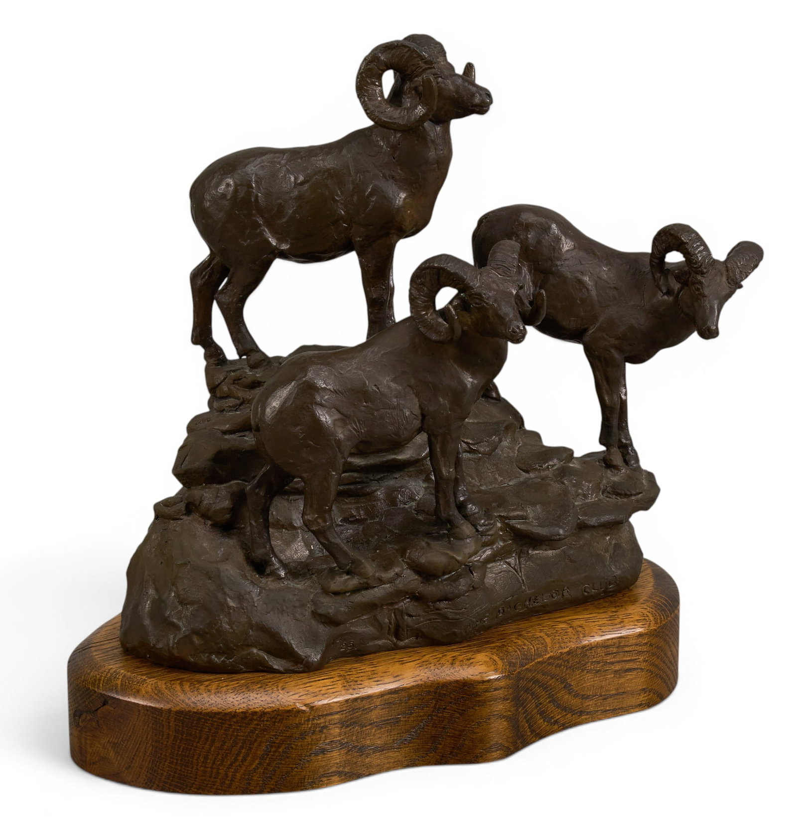 Malcolm Mackenzie, "The Bachelor Club": Malcolm James Mackenzie (Canada, 1932-2002), "The Bachelor Club", artist-cast bronze sculpture on wooden base, incised signature, title, edition number 14/25, and date, 1971 height 11